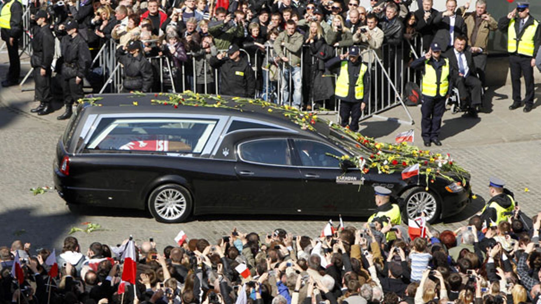 April 18: People stand along a street as a hearse carrying the coffin of the late Polish President Lech Kaczynski arrives in Krakaow, southern Poland. (AP)