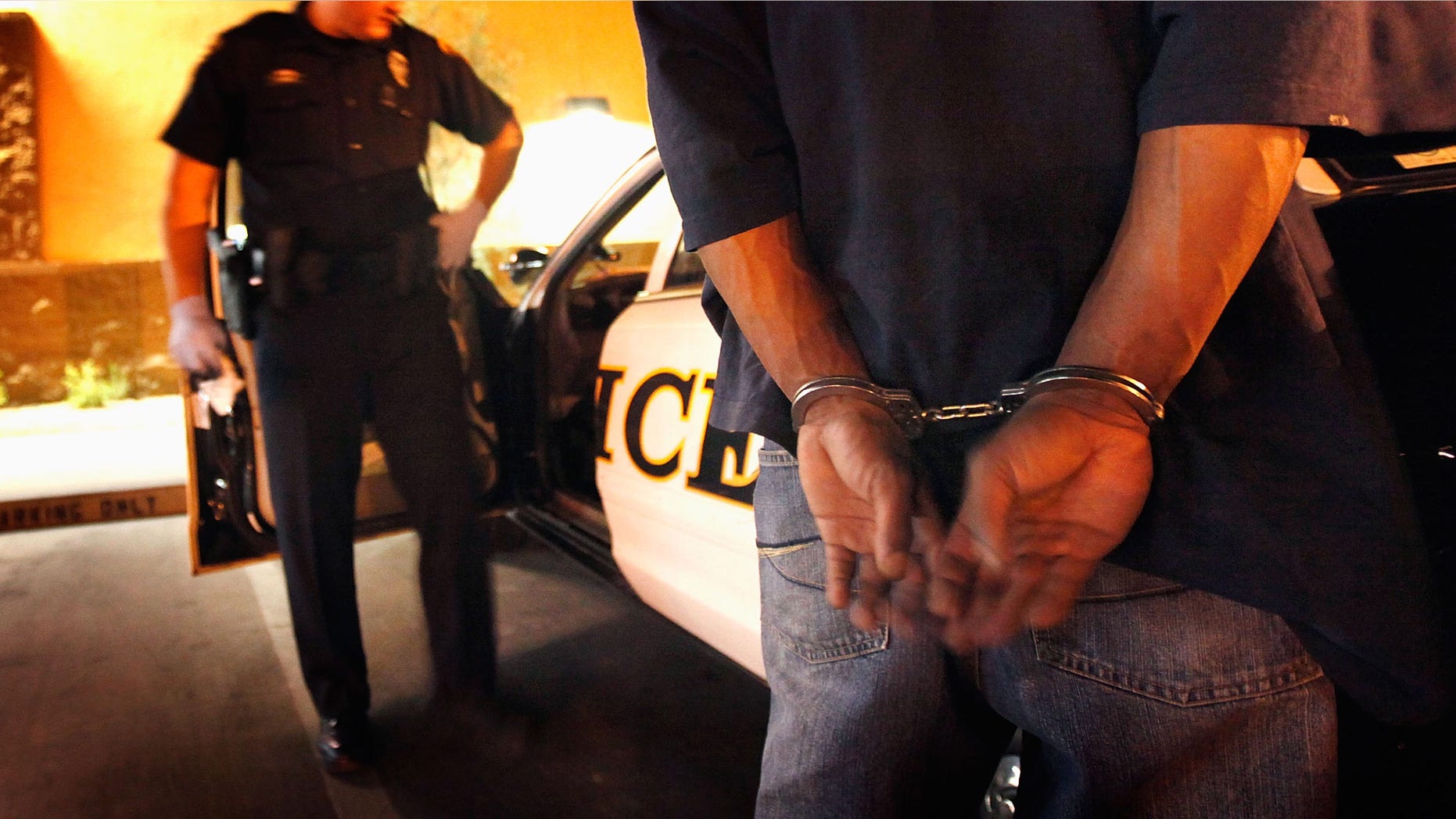 TUCSON, AZ - MAY 29: Tucson Police Officer Angel Ramirez arrests a man for trespassing May 29, 2010 in Tucson, Arizona. Ramirez works in the city's predominately Hispanic south side. The Tucson Police Department is currently gearing up to begin training its officers on the implementation of the controversial new immigration law SB 1070. Although a Tucson police officer was one of the first to file suit in federal court challenging the new law, most rank and file officers tend to support the legislation while the Arizona Chiefs of Police have criticized it. (Photo by Scott Olson/Getty Images)