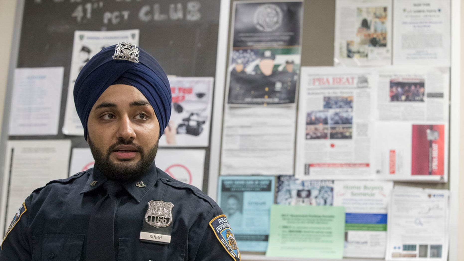 In this Tuesday, Jan. 24, 2017 photo, New York City police officer Mandeep Singh speaks during an interview with The Associated Press at the 41st Precinct in the Bronx borough of New York.