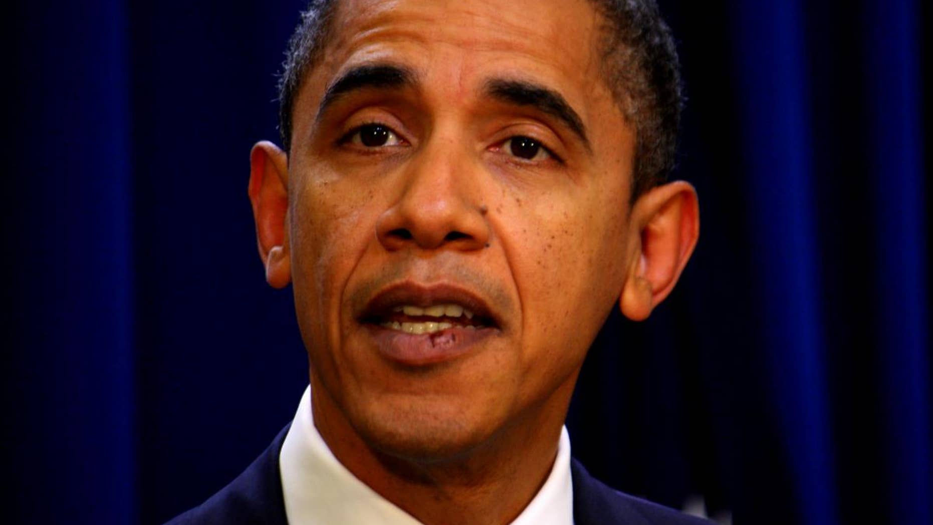 President Obama speaks to the press November 29. His stitches are easily visible. (Network pool photo)