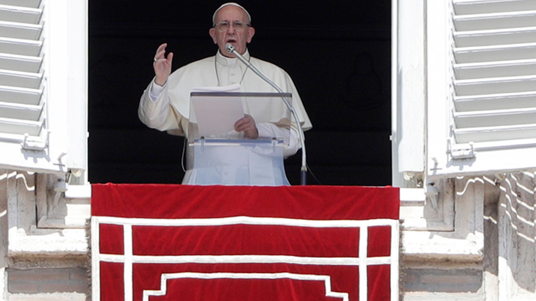 Pope Francis delivers his blessing as he recites the Angelus noon prayer in St. Peter's Square at the Vatican, Sunday, Sept. 3, 2017. (AP Photo/Gregorio Borgia)