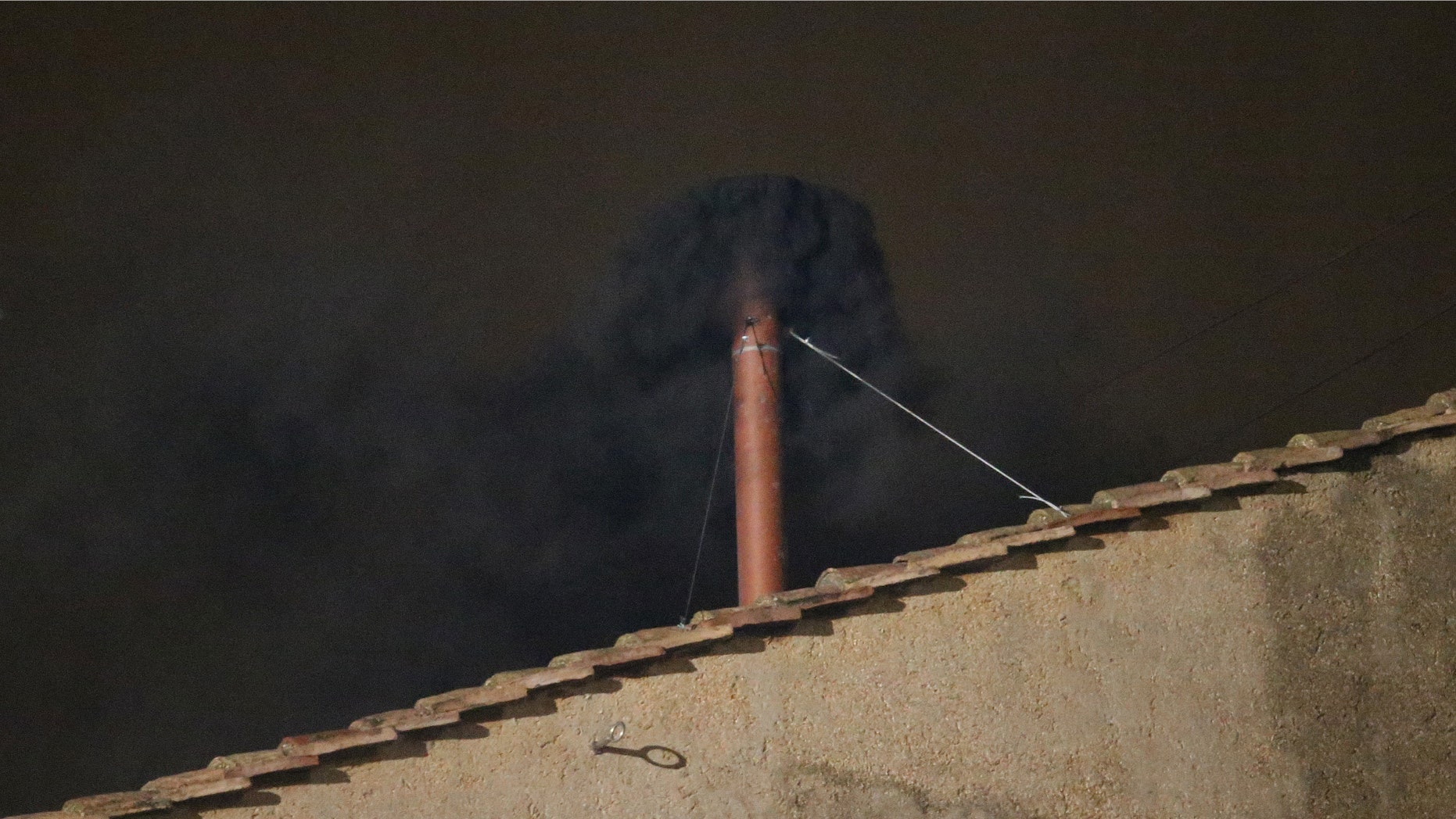 VATICAN CITY, VATICAN - MARCH 12: Black smoke billows out from a chimney on the roof of the Sistine Chapel indicating that the College of Cardinals have failed to elect a new Pope on March 12, 2013 in Vatican City, Vatican. Pope Benedict XVI's successor is being chosen by the College of Cardinals in Conclave in the Sistine Chapel. The 115 cardinal-electors, meeting in strict secrecy, will need to reach a two-thirds-plus-one vote majority to elect the 266th Pontiff. (Photo by Peter Macdiarmid/Getty Images)