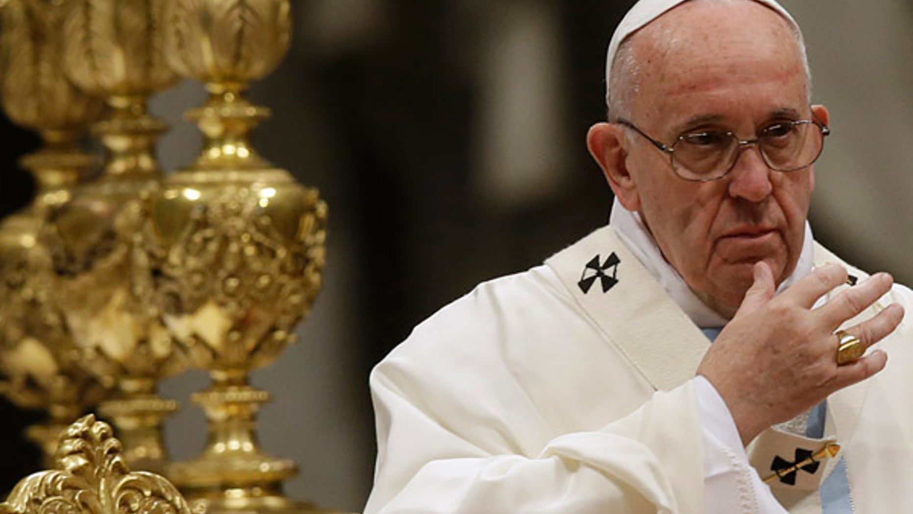 Jan. 1, 2016: Pope Francis makes the sign of the cross as he celebrates a New Year mass in St. Peter's Basilica at the Vatican. (AP)