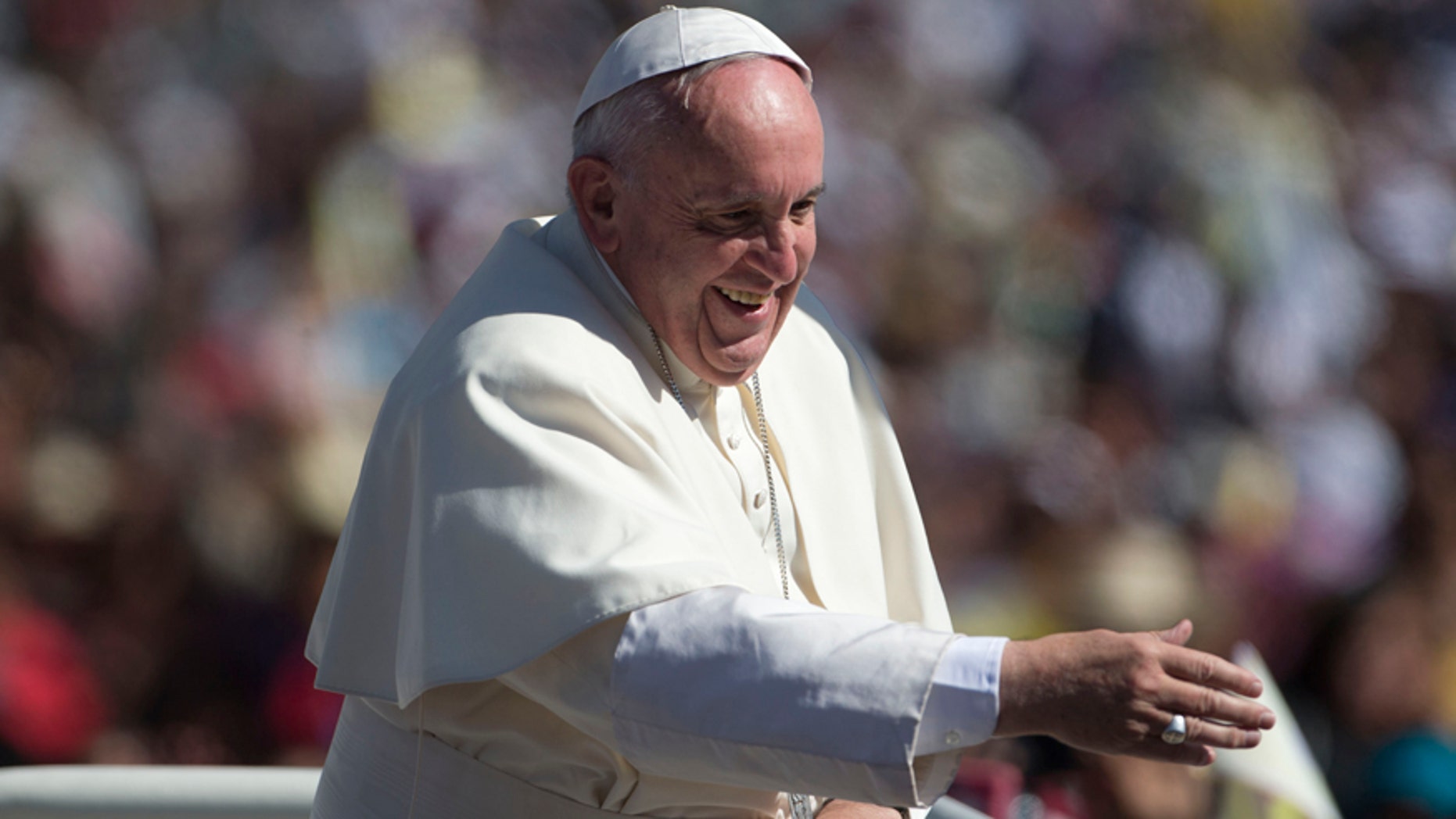 Pope Francis waves from his popemobile as he arrives in San Cristobal de las Casas, Mexico, Monday, Feb. 15, 2016. Francis is celebrating Mexico's Indians on Monday with a visit to Chiapas state, a center of indigenous culture, where he will preside over a Mass in three native languages thanks to a new Vatican decree approving their use in liturgy. The visit is also aimed at boosting the faith in the least Catholic state in Mexico. (AP Photo/Eduardo Verdugo)