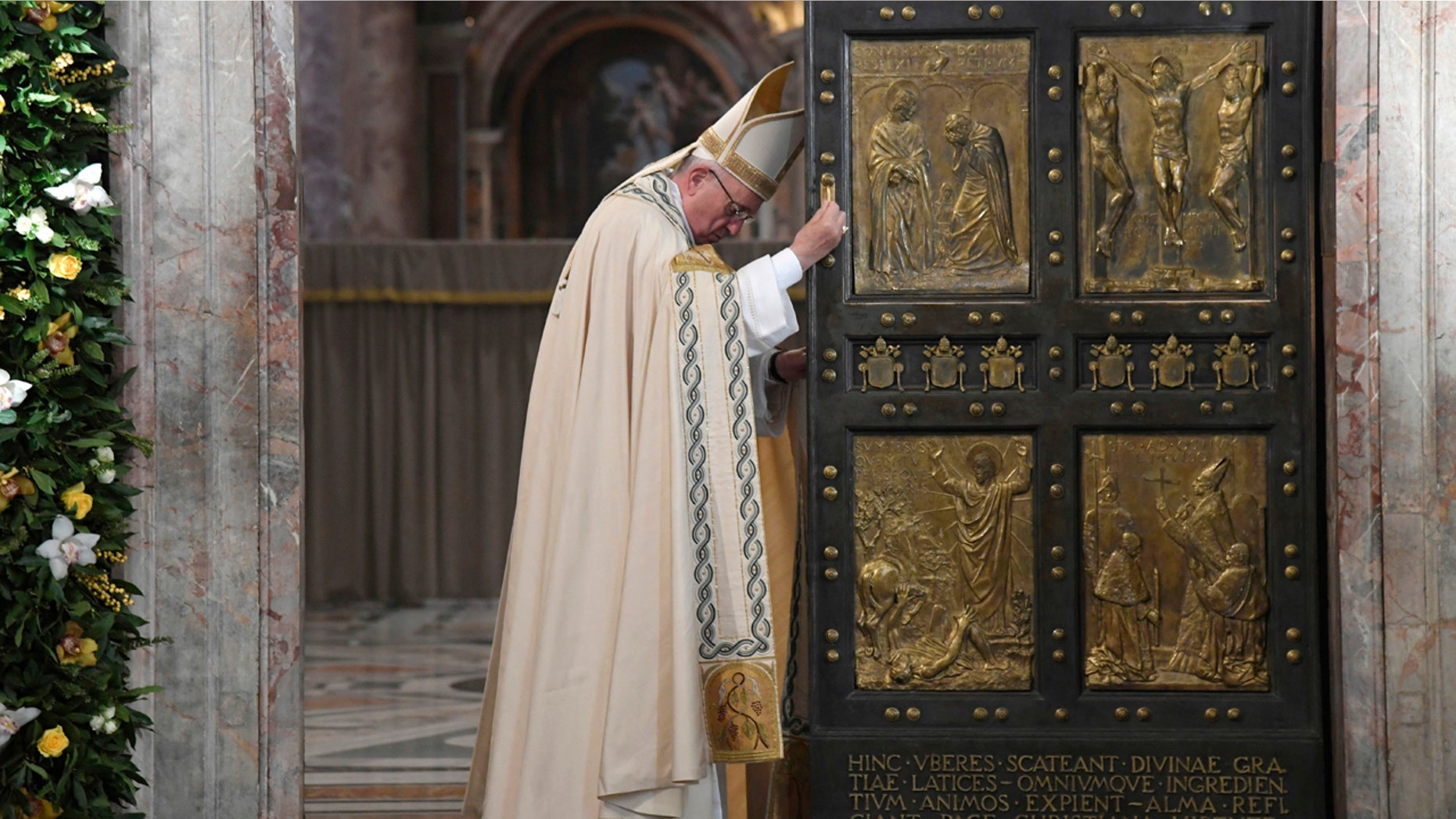 Pope Francis closes the Holy Door of St. Peter's Basilica at the Vatican, Sunday, Nov. 20, 2016. Pope Francis has pulled shut the Holy Door of St. Peters Basilica, formally ending the Holy Year of Mercy he declared to highlight that virtue. (Tiziana Fabi/pool photo via AP)