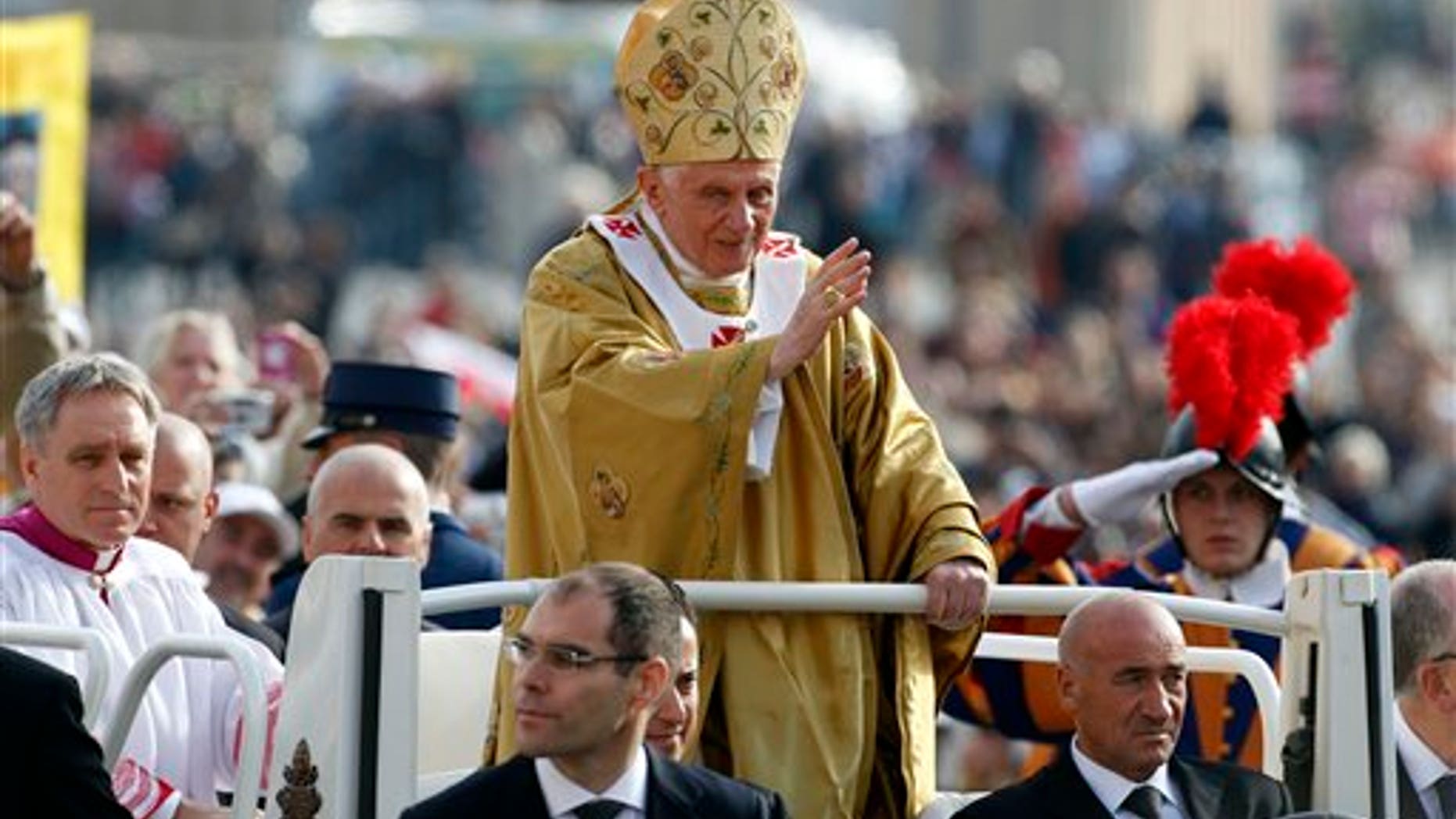 Pope Benedict XVI, center, delivers his blessing as he arrives in St. Peter's square at the Vatican to celebrate a beatification mass, Sunday, Oct. 23, 2011. The pontiff canonized three 19th-century founders of religious orders: Italian bishop and missionary Monsignor Guido Maria Conforti, Spanish nun Sister Bonifacia Rodriguez de Castro and an Italian priest who worked with the poor, the Rev. Luigi Guanella. (AP Photo/Pier Paolo Cito)