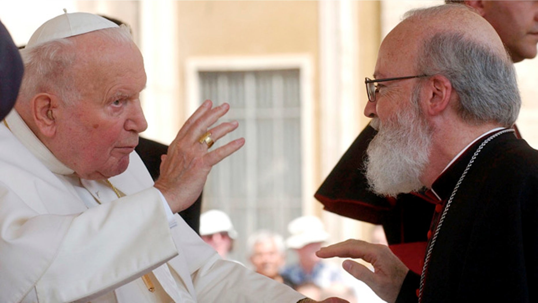 In this June 30, 2004, file photo, Pope John Paul II blesses Msgr. Sean Patrick O'Malley, Archbishop of Boston, during the weekly open-air general audience in St. Peter's square at the Vatican. Among the eight cardinals Pope Francis chose as his new "kitchen cabinet," only one is from North America: Boston Cardinal Sean O'Malley. The panel of cardinals has planned to meet at the Vatican for the first time Oct. 1, 2013.