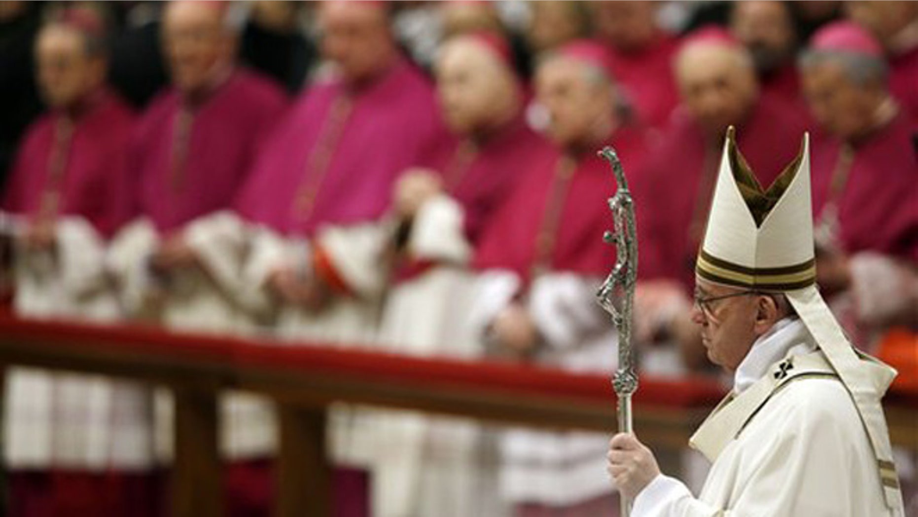 Pope Francis arrives to celebrate the Christmas Eve Mass in St. Peter's Basilica at the Vatican, Thursday, Dec. 24, 2015. (AP Photo/Gregorio Borgia)