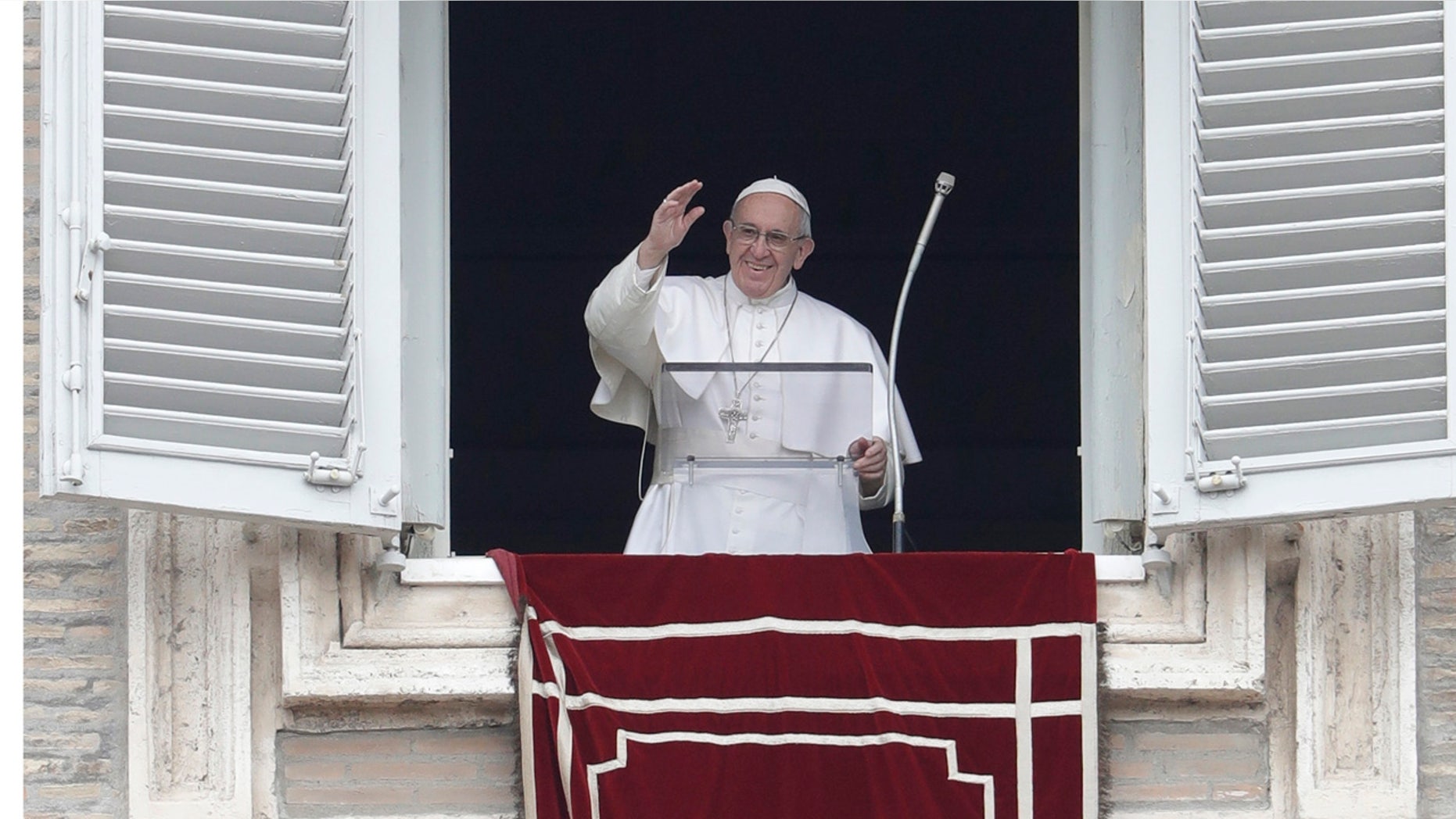 Feb. 5, 2017: Pope Francis waves from his studio window overlooking St. Peter's Square during his Angelus prayer at the Vatican