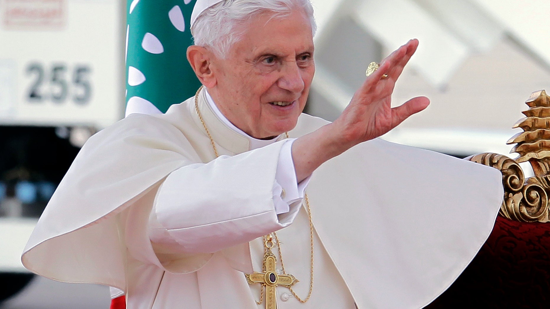 Pope Benedict XVI waves his hand upon arrival at Rafik Hariri international airport, in Beirut, Lebanon, Friday, Sept. 14, 2012. Pope Benedict XVI arrived in Lebanon on Friday to urge peace at a time of great turmoil in the Middle East, saying the import of weapons to Syria during the country's civil war is a "grave sin." The three-day visit comes at a time of turmoil in the region the civil war in neighboring Syria and in the aftermath of a mob attack that killed several Americans in Libya, including the U.S. ambassador. (AP Photo/Bilal Hussein)