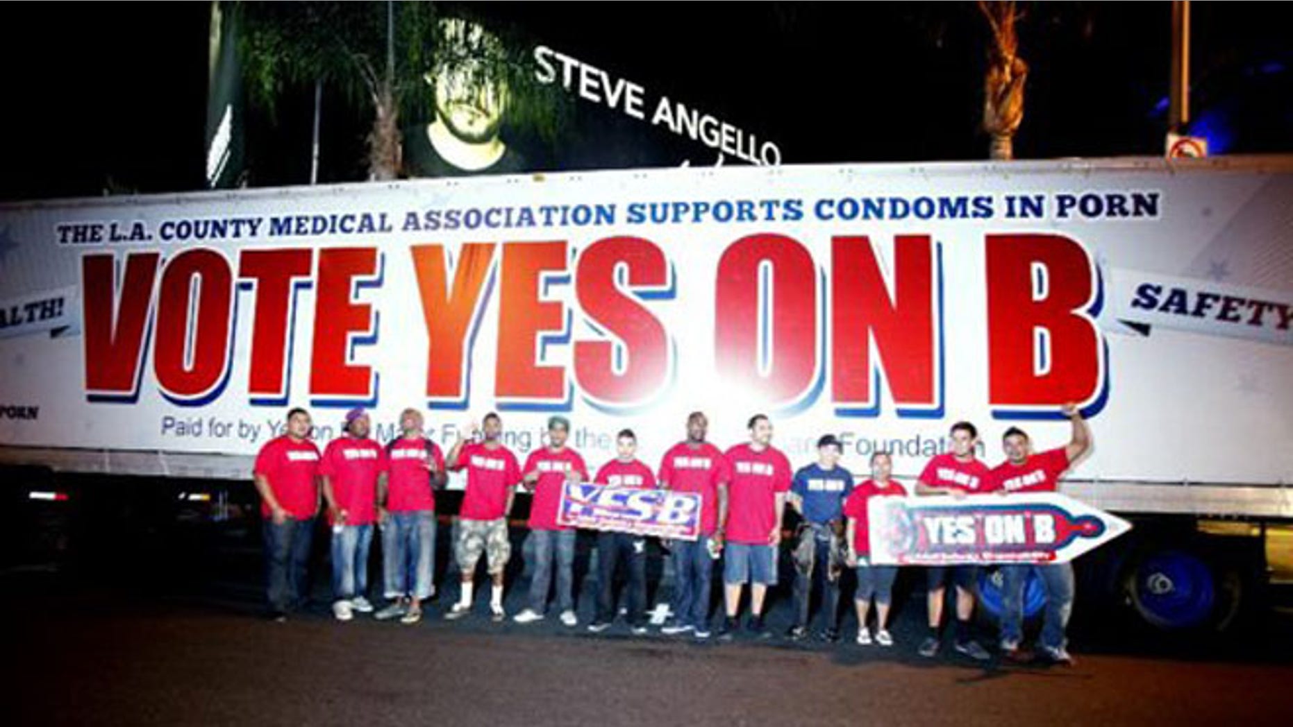 FILE: Oct. 27, 2012: Supporters for the condoms for porn actors ballot initiative seen on Sunset Strip after an all day caravan to five cities throughout Los Angeles.