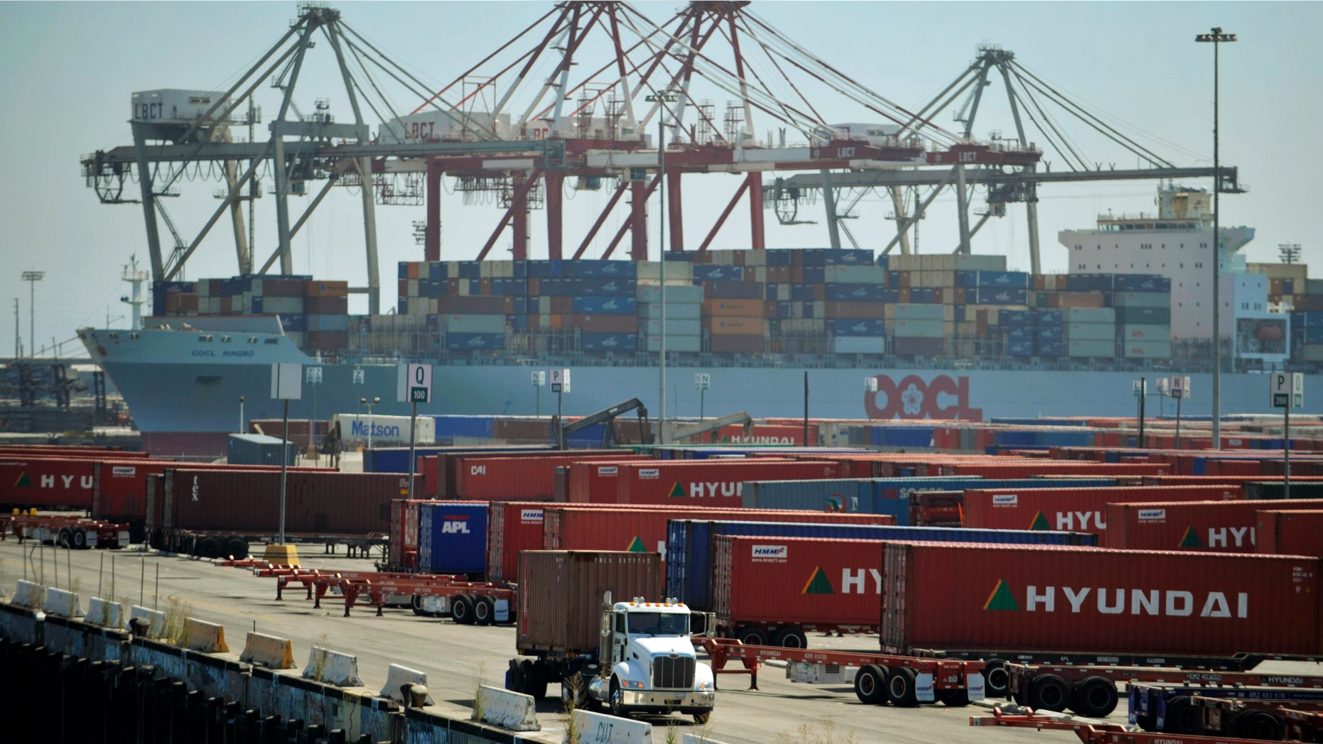 Aug. 24, 2009: A truck passes containers at the Port of Long Beach in Long Beach, Calif.