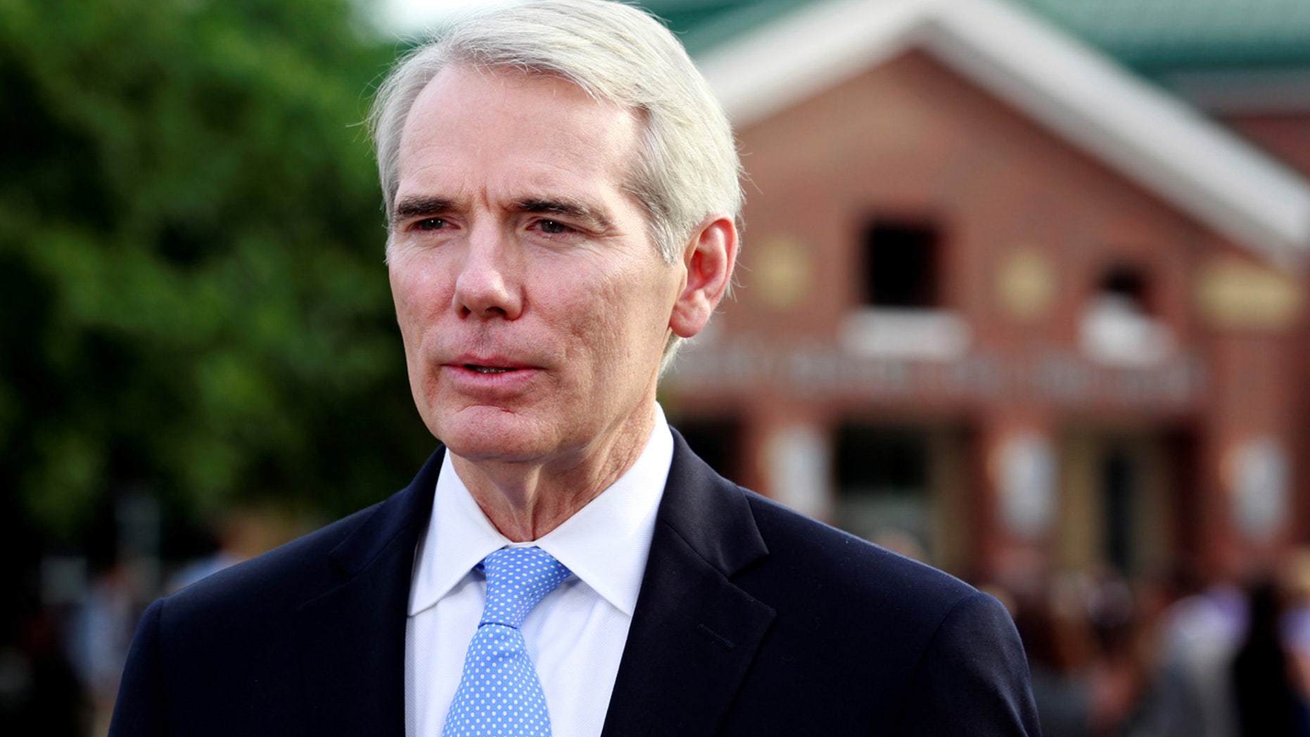 Sen. Rob Portman, R-Ohio, addresses the media outside the art center before a funeral service for Otto Warmbier, who died after his release from North Korea, at Wyoming High School in Wyoming, Ohio, U.S. June 22, 2017.