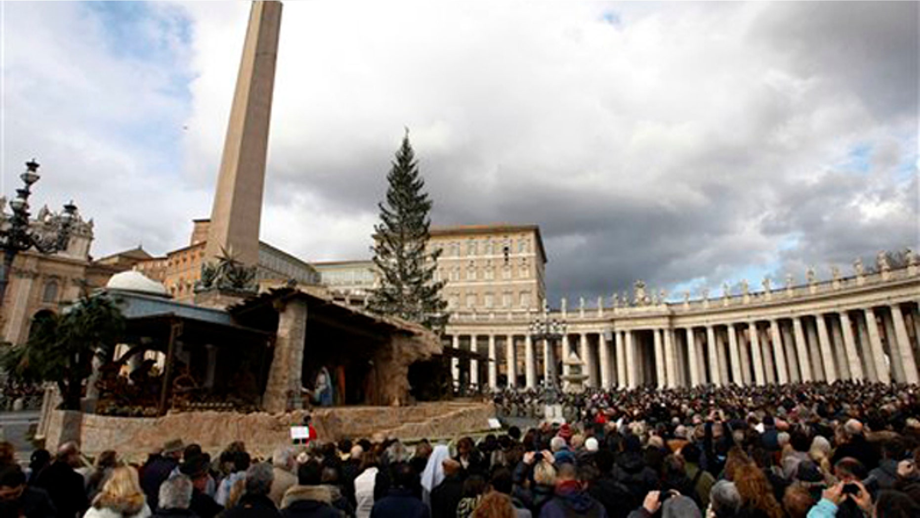 Dec. 26, 2010: People gather in St. Peter's square at the Vatican as Pope Benedict XVI delivers his blessing during the Angelus noon prayer he celebrated from the window of his studio. The pontiff denounced Christmas attacks on the faithful in the Philippines and Nigeria and called for the peaceful resolution of conflicts.
