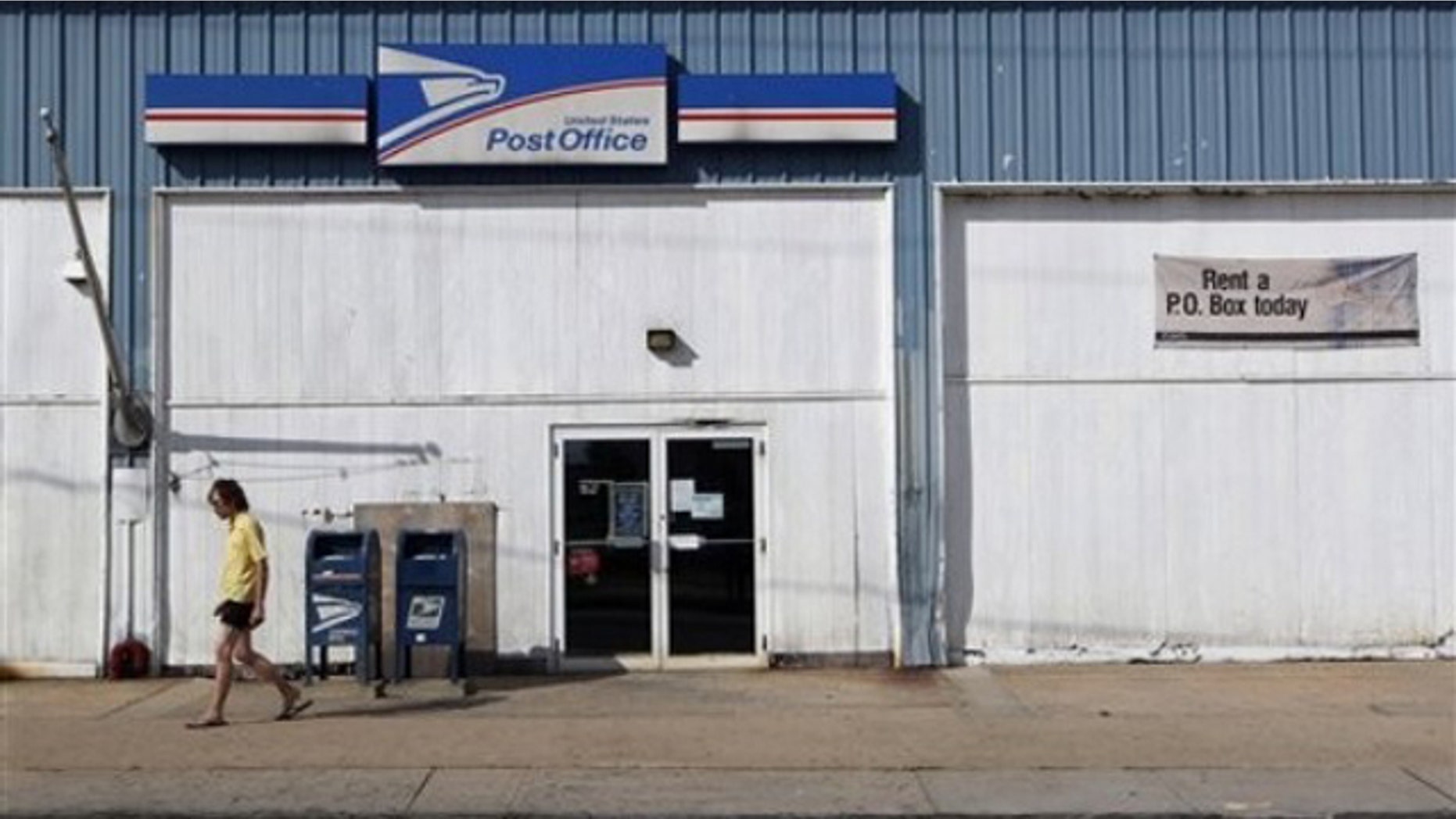 A man walks away from a post office July 27 in New Brunswick, N.J.