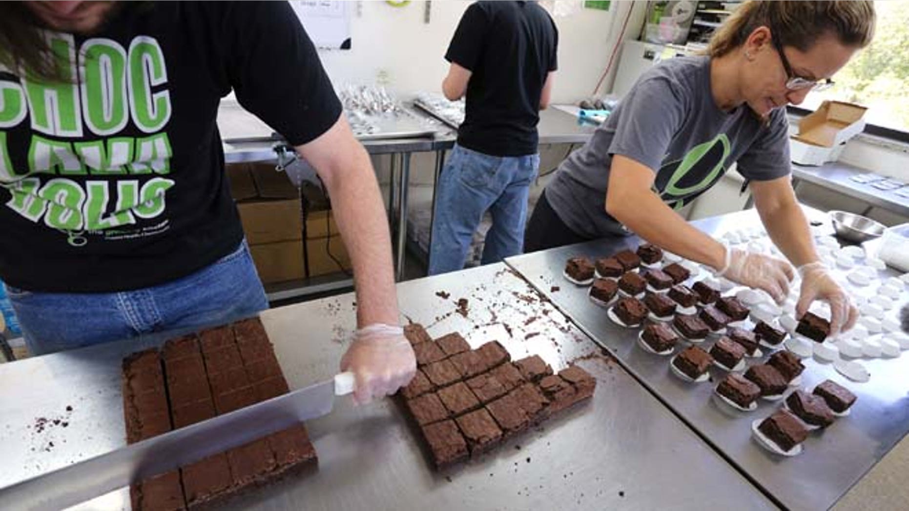 Sept. 26, 2014: In this file photo, smaller-dose pot-infused brownies are divided and packaged at The Growing Kitchen, in Boulder, Colo. Colorado health officials want to ban many edible forms of marijuana, including brownies, cookies and most candies, limiting sales of pot-infused food to lozenges and some liquids.