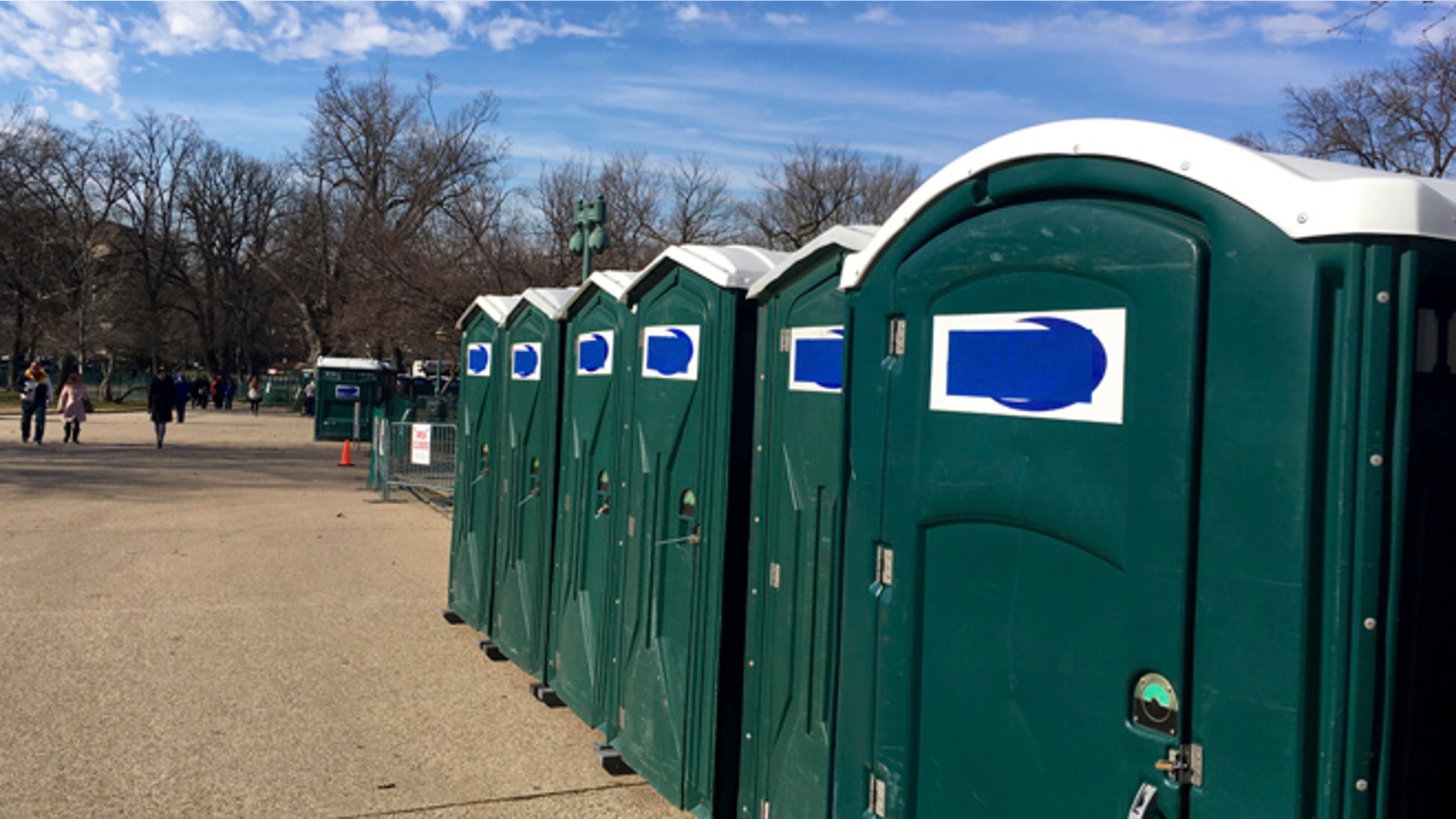 A row of portable restrooms, with the name Dons Johns covered up, is seen on Capitol Hill in Washington, Friday, Jan. 13, 2017. Virginia-based Dons Johns calls itself the Washington areas top provider of portable toilet rentals, but the name apparently strikes too close to home for inaugural organizers. Workers have placed blue tape over the brand name on dozens of portable restrooms installed near the Capitol for the inauguration. (AP Photo/Matthew Daly)