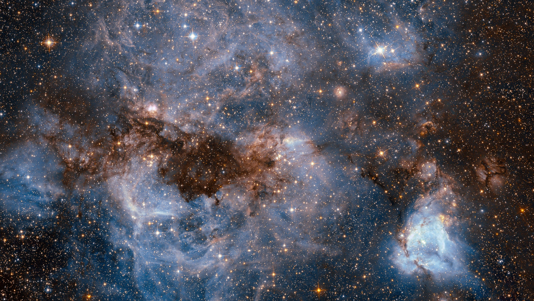 This breathtaking new image from the Hubble Space Telescope captures electric-blue wisps of gas and bright stars in the early stages of birth.