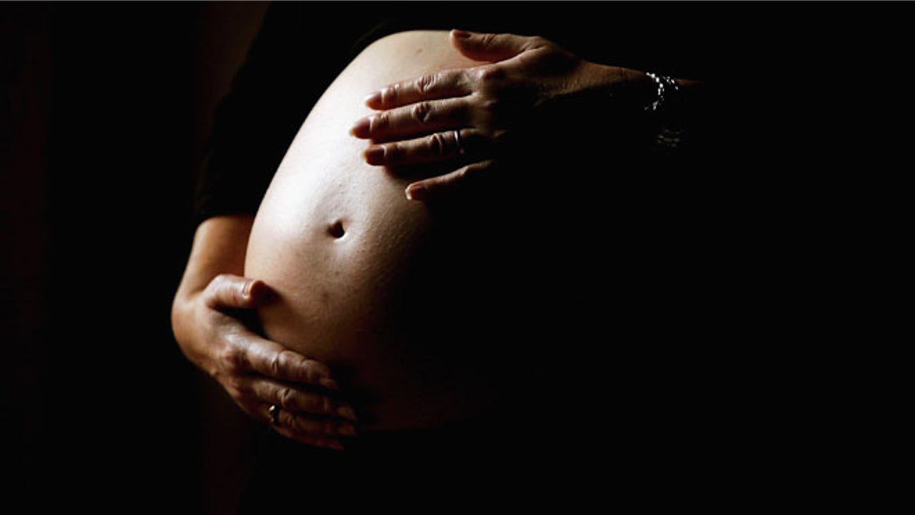 SYDNEY, NSW - JUNE 07: A pregnant woman holds her stomach June 7, 2006 in Sydney, Australia. Australia is currently enjoying a baby boom, with the Australian Bureau of Statistics registering a 2.4% increase in births from 2004 to 2005, which represents the highest number of births since 1992. The Australian Federal Government has been encouraging people to have more babies, with financial incentives and the slogan by treasurer Peter Costello to "have one for mum, one for dad, and one for the country". The Federal Government has identified falling fertility rates and the ageing population as long-term problems for Australia's growth and prosperity. (Photo by Ian Waldie/Getty Images)
