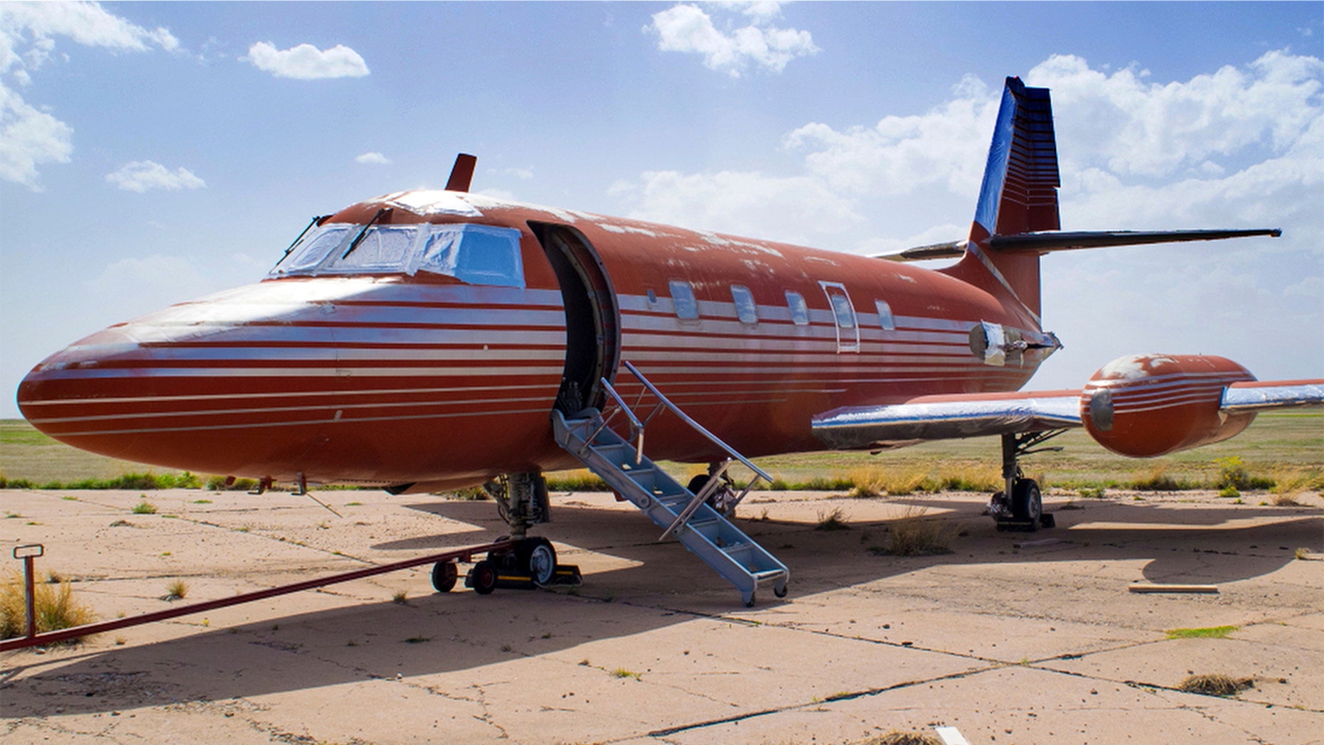 This undated file photo provided by GWS Auctions, Inc. shows a private jet once owned by Elvis Presley, on a runway in New Mexico.