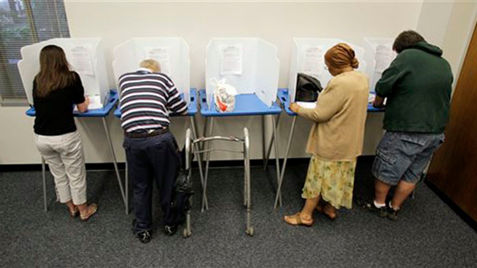 Voters cast their ballots during early voting for the Indiana primary election in Indianapolis May 3. (AP Photo)