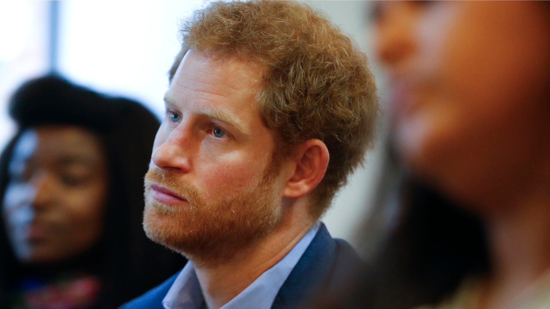 This is a Monday, Dec. 19, 2016 file photo of Britain's Prince Harry listens to a seminar for members of staff during a visit to the Mix in London.