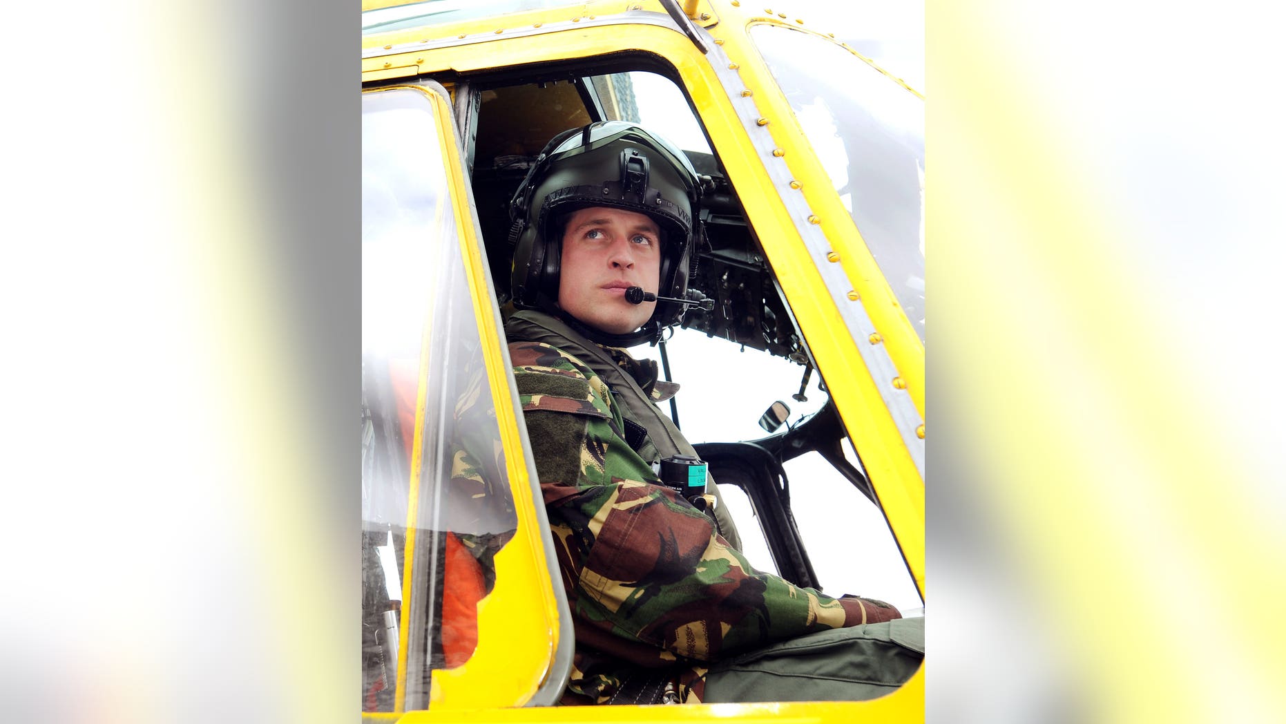 March 31, 2011. Prince William sits at the controls of a Sea King helicopter during a training exercise at Holyhead Mountain, in Wales.