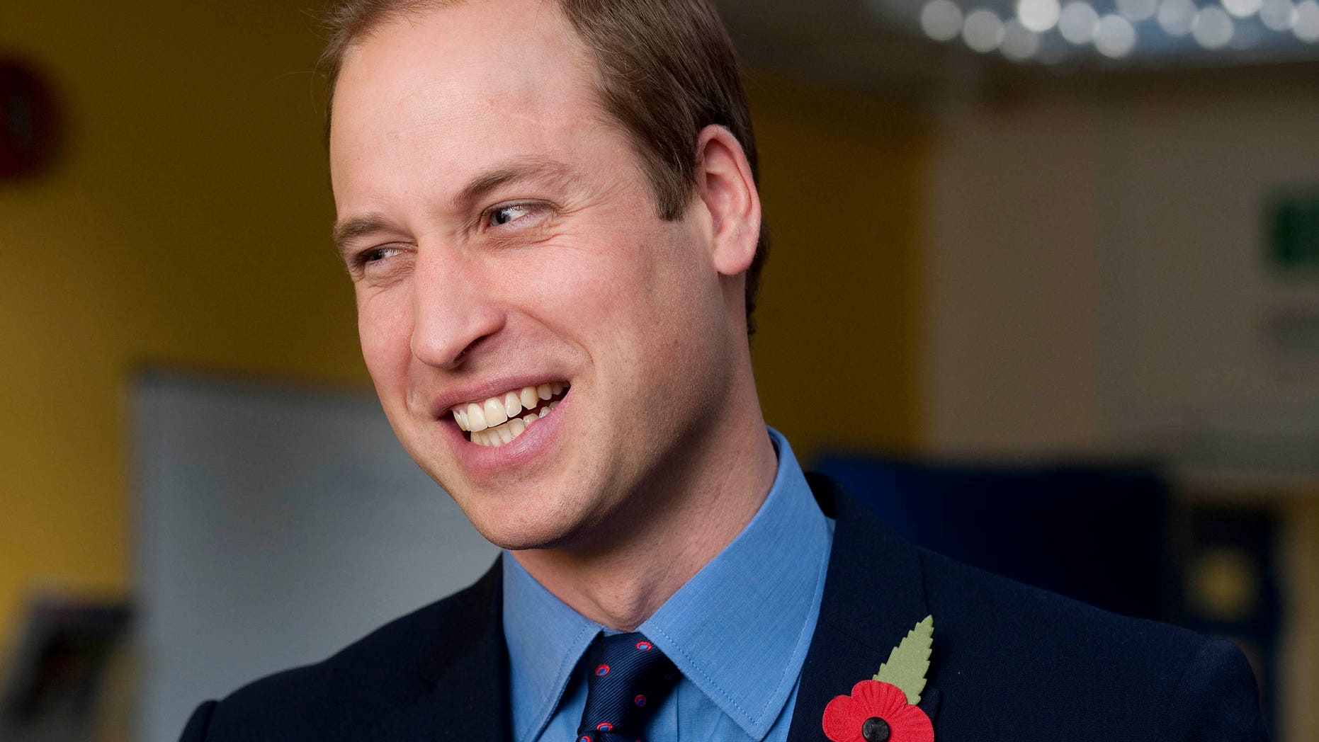 November 6, 2013. Prince William smiles during a visit to the head office of the St Giles Trust, in Camberwell, south east London.