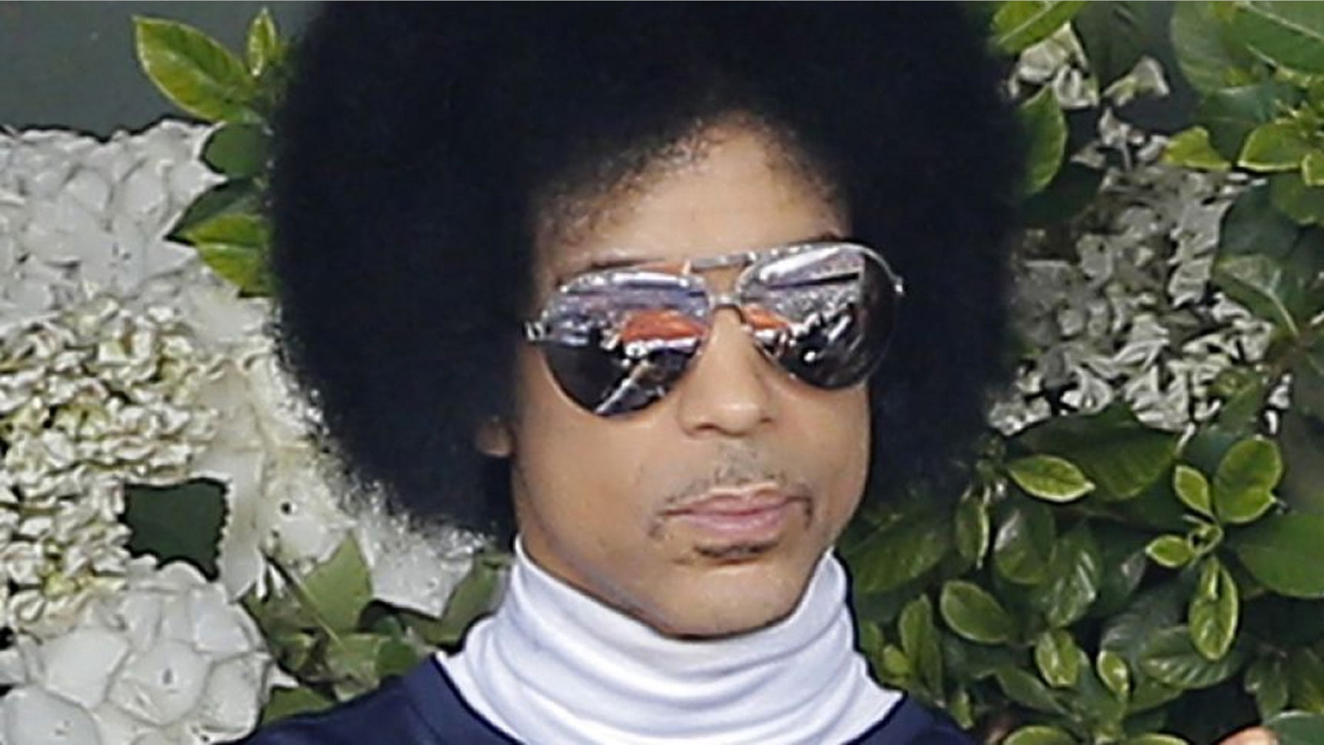 Prince's passport photo (see below) is amazing.