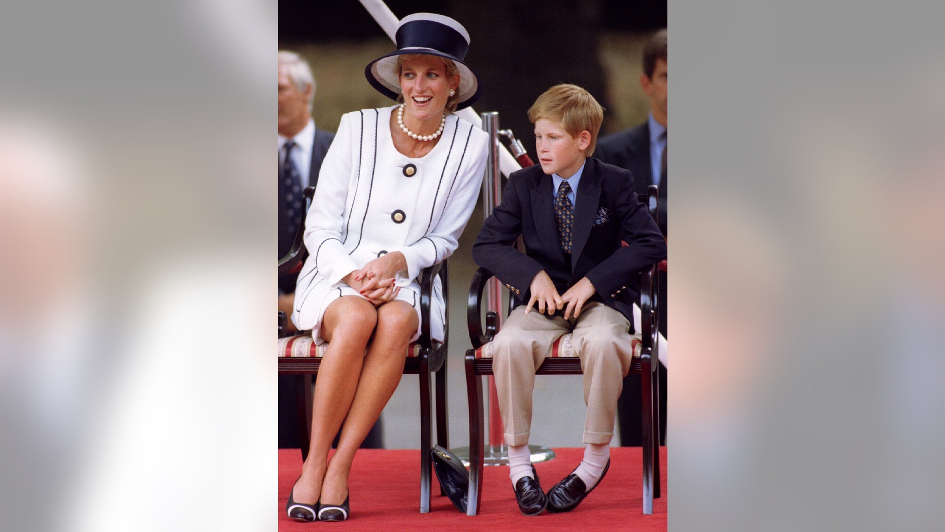 File photo - The Princess of Wales and Prince Harry attend VJ (Victory over Japan) Day ceremonies in the Mall Aug. 19, 1995. (Reuters).