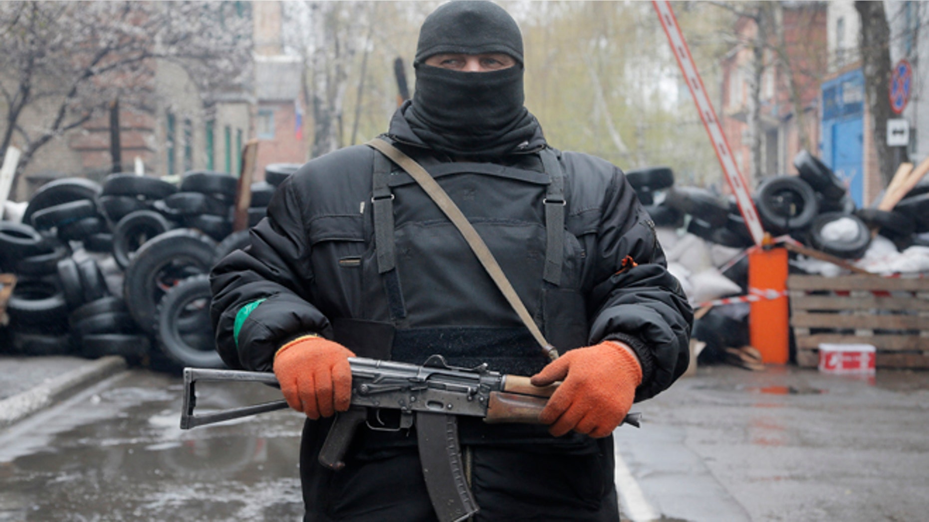 April 13, 2014: A pro-Russian gunman stands guard at a seized police station in the eastern Ukraine town of Slovyansk.