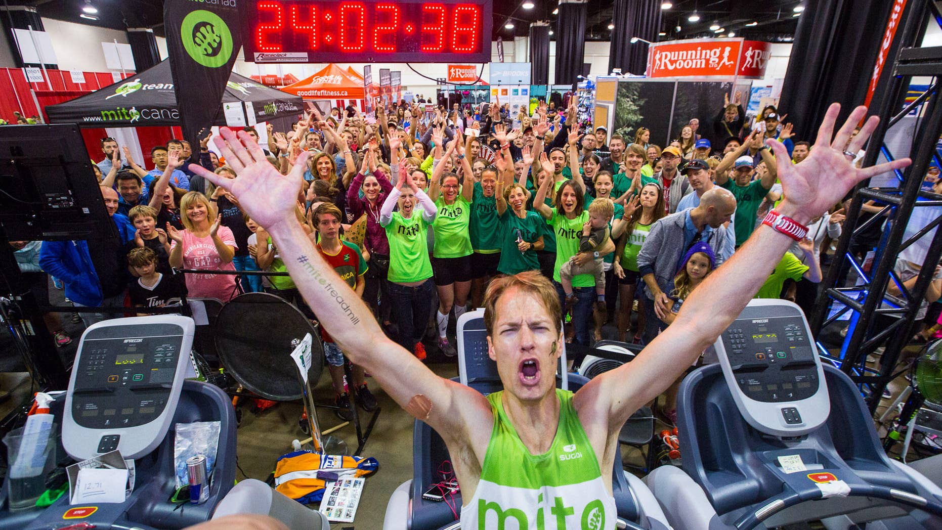 Dave Proctor celebrates setting the 24-hour treadmill record. (Photography by Neil Zeller)