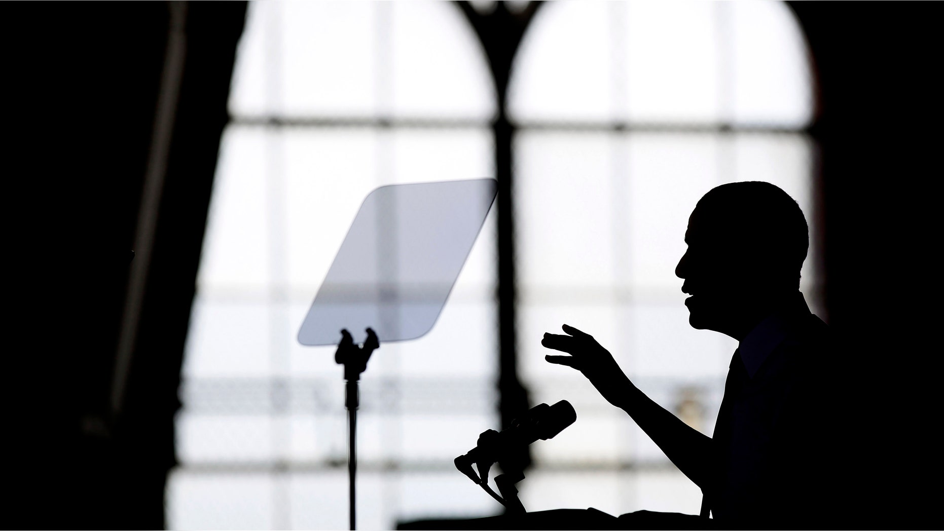 ANN ARBOR, MI - APRIL 2: U.S. President Barack Obama is silhouetted as he speaks about his proposal to raise the federal minimum wage at the University of Michigan on April 2, 2014 in Ann Arbor, Michigan. Obama said every American deserves a fair working wage.(Photo by Joshua Lott/Getty Images)