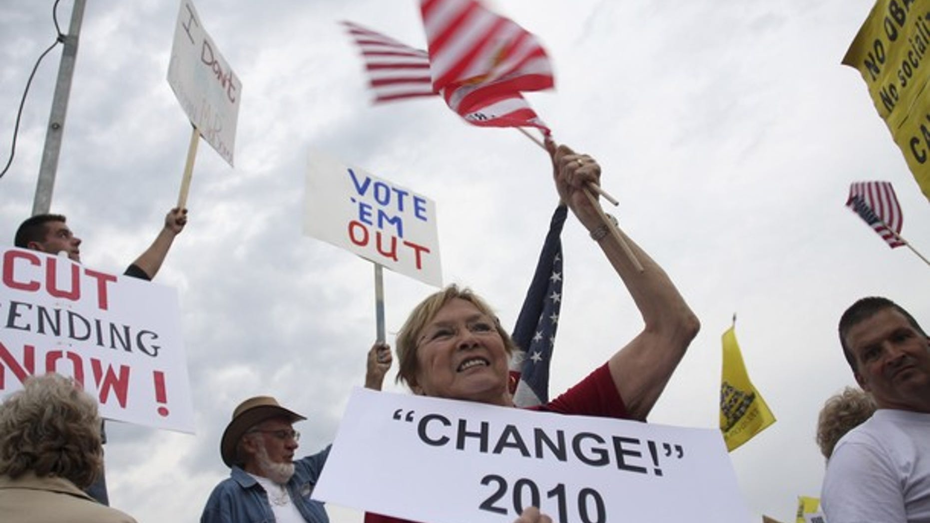 Aug. 17: Tea Party protesters in Arizona hold signs demanding Congess cut spending.