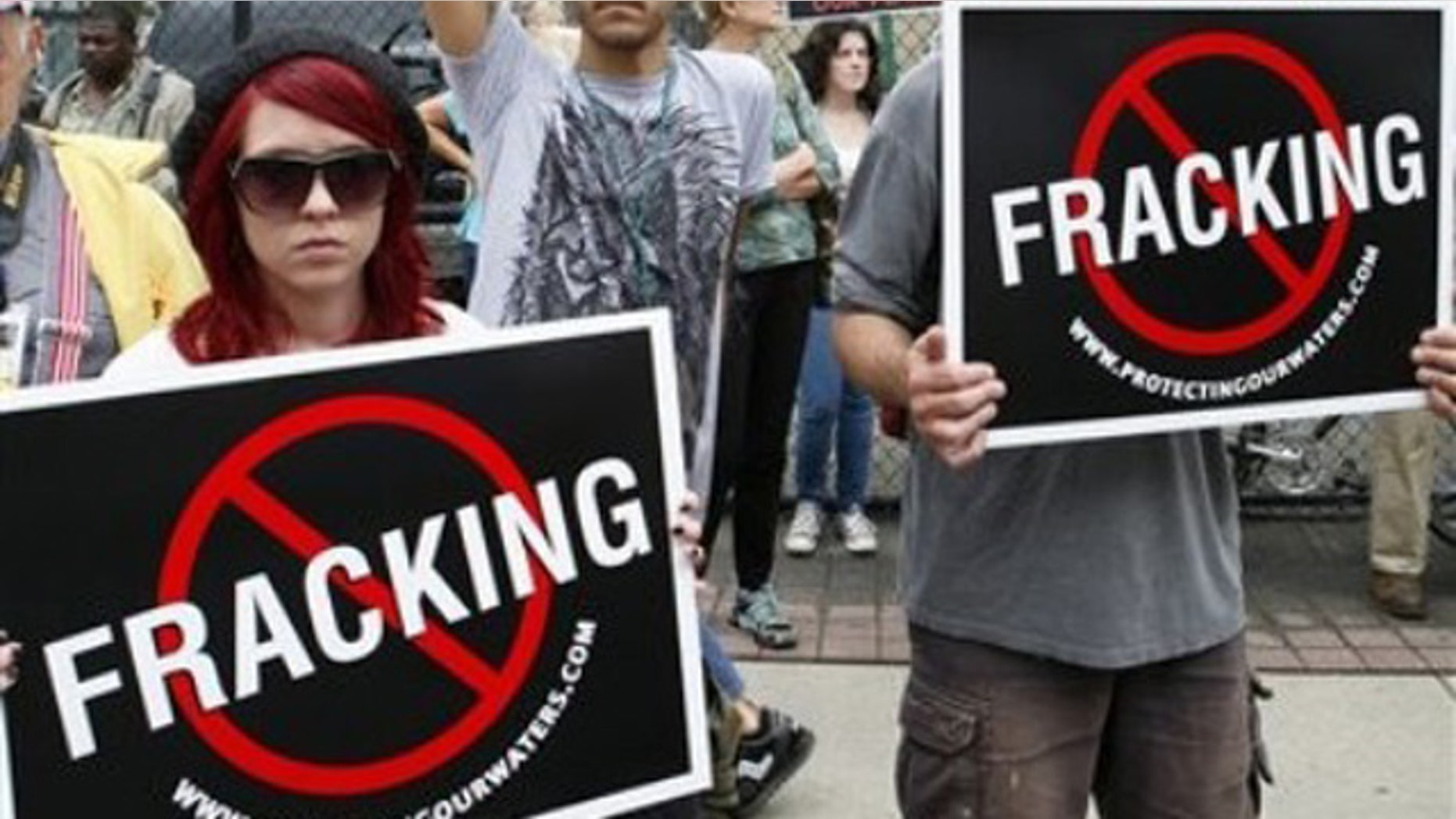 Sept. 7, 2011: Protesters in Philadelphia hold up signs protesting against hydraulic gas drilling, or 'fracking,' outside the Philadelphia convention center.