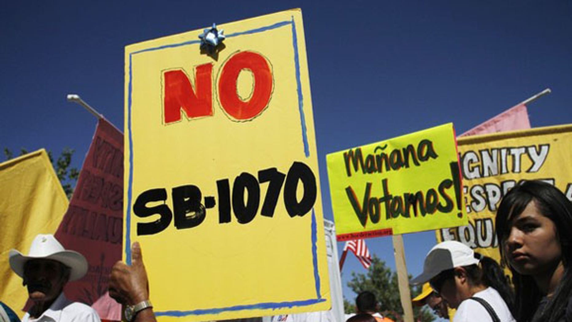 Demonstrators protest against Arizona's immigration law in Phoenix last year.