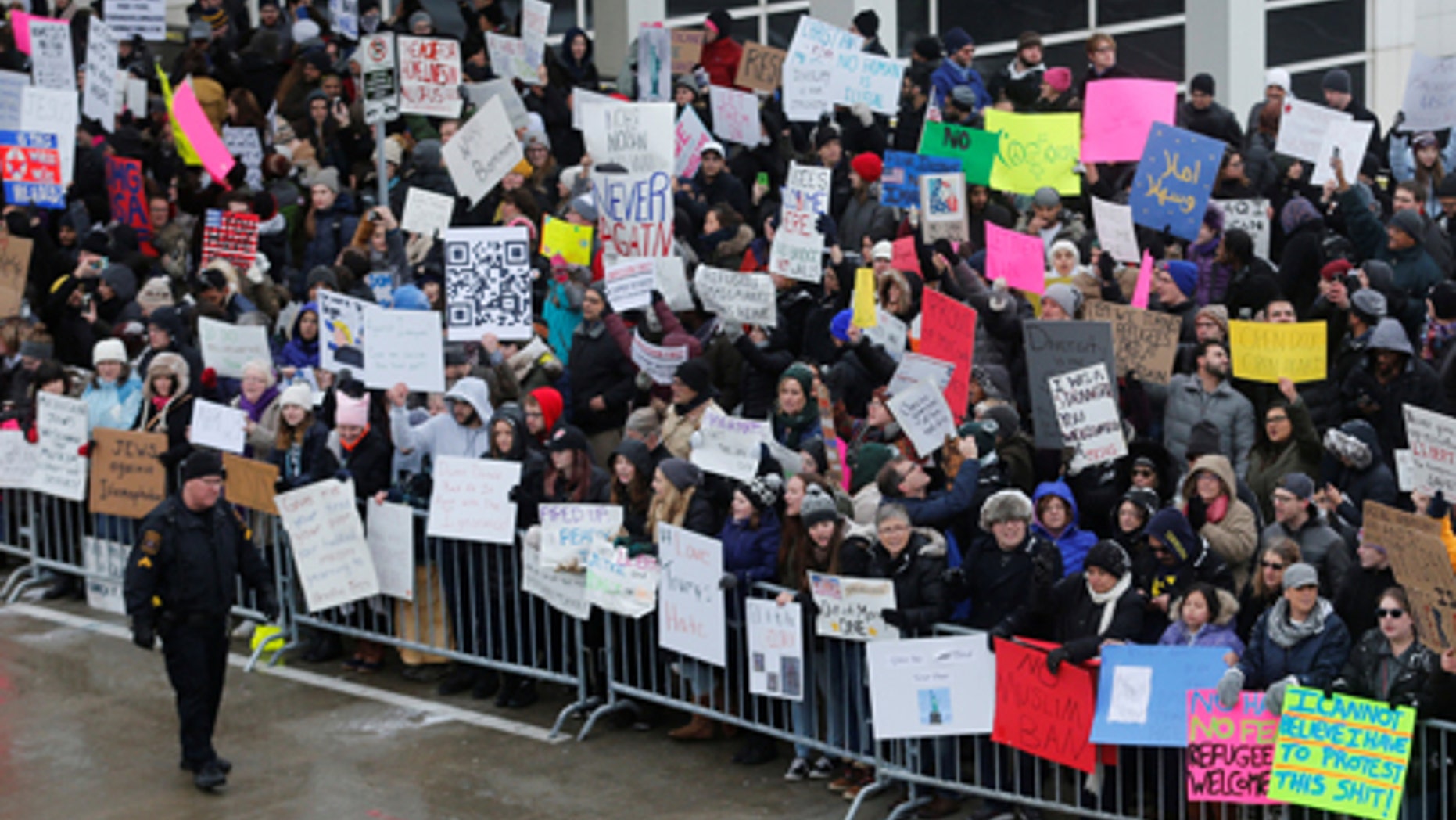 Hundreds of people rally against a temporary travel ban signed by U.S. President Donald Trump in an executive order during a protest at Detroit Metropolitan airport in Romulus, Michigan, U.S., January 29, 2017.