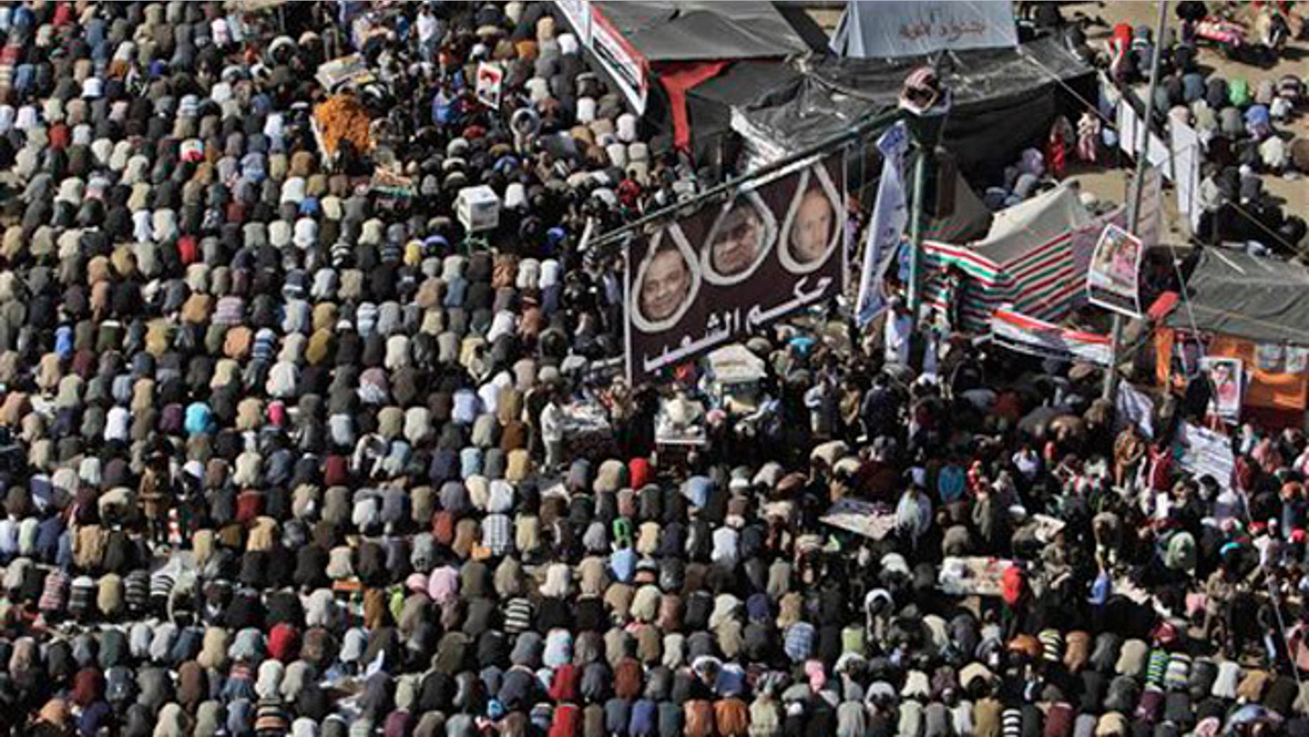 Jan. 27, 2012: Egyptian protesters attend Friday prayers during a rally to mark the first anniversary of the 'Friday of Rage' in Tahrir Square, in Cairo, Egypt.