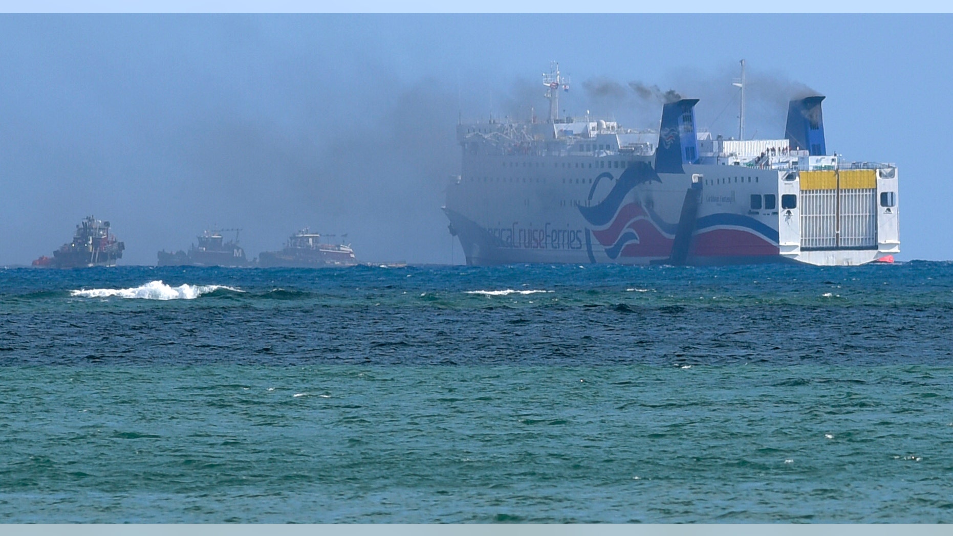 Smoke spills from a ferry off the coast of San Juan, Puerto Rico.