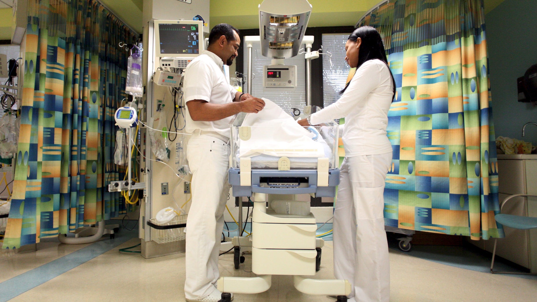 Nurses attend to a young patient at the Cardiovascular Center of Puerto Rico and the Caribbean in San Juan, October 21, 2015. REUTERS/Alvin Baez
