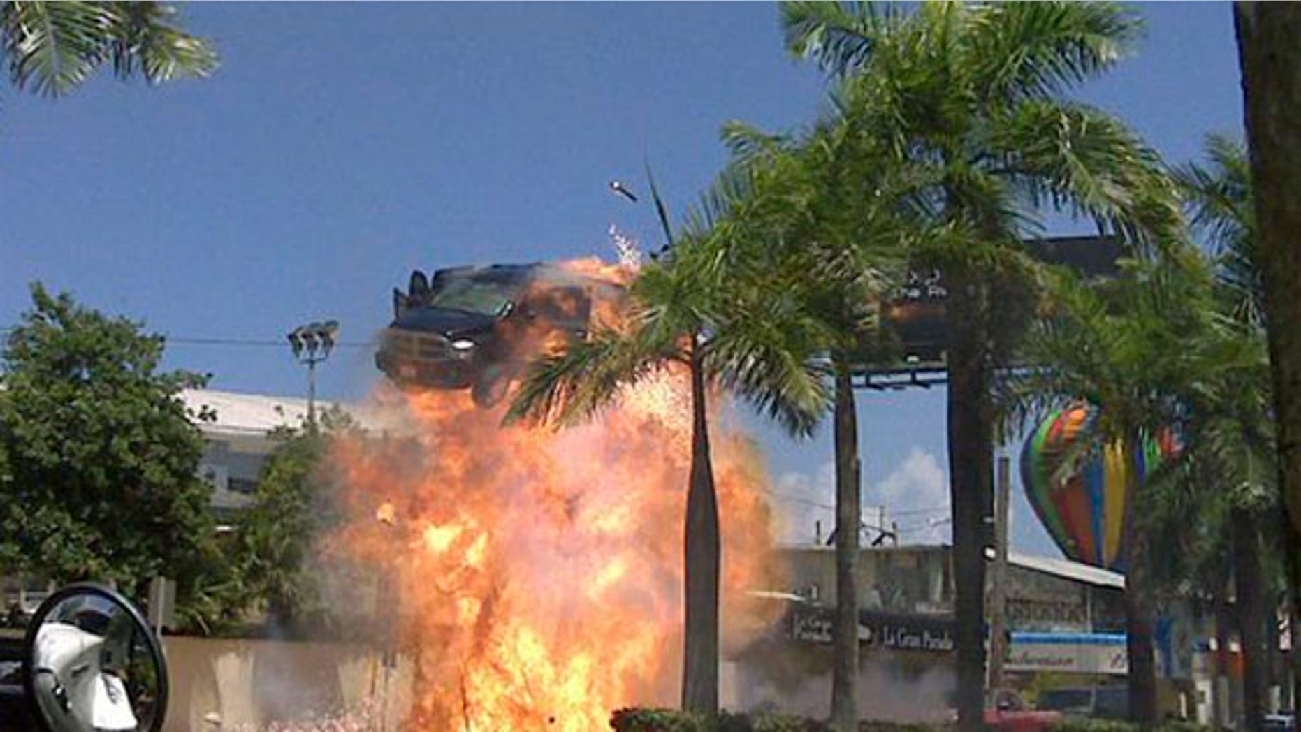 In this photo taken Aug. 16, 2009 released by the Puerto Rico Film Commission,, a car is blown up during the filming of "The Losers", directed by Sylvain White, in San Juan, Puerto Rico. The Caribbean island is increasingly a backdrop in American and European cinema, standing in for Baghdad war zones, Brazilian slums, or cookie-cutter American suburbs. (AP Photo/Puerto Rico Film Commission)