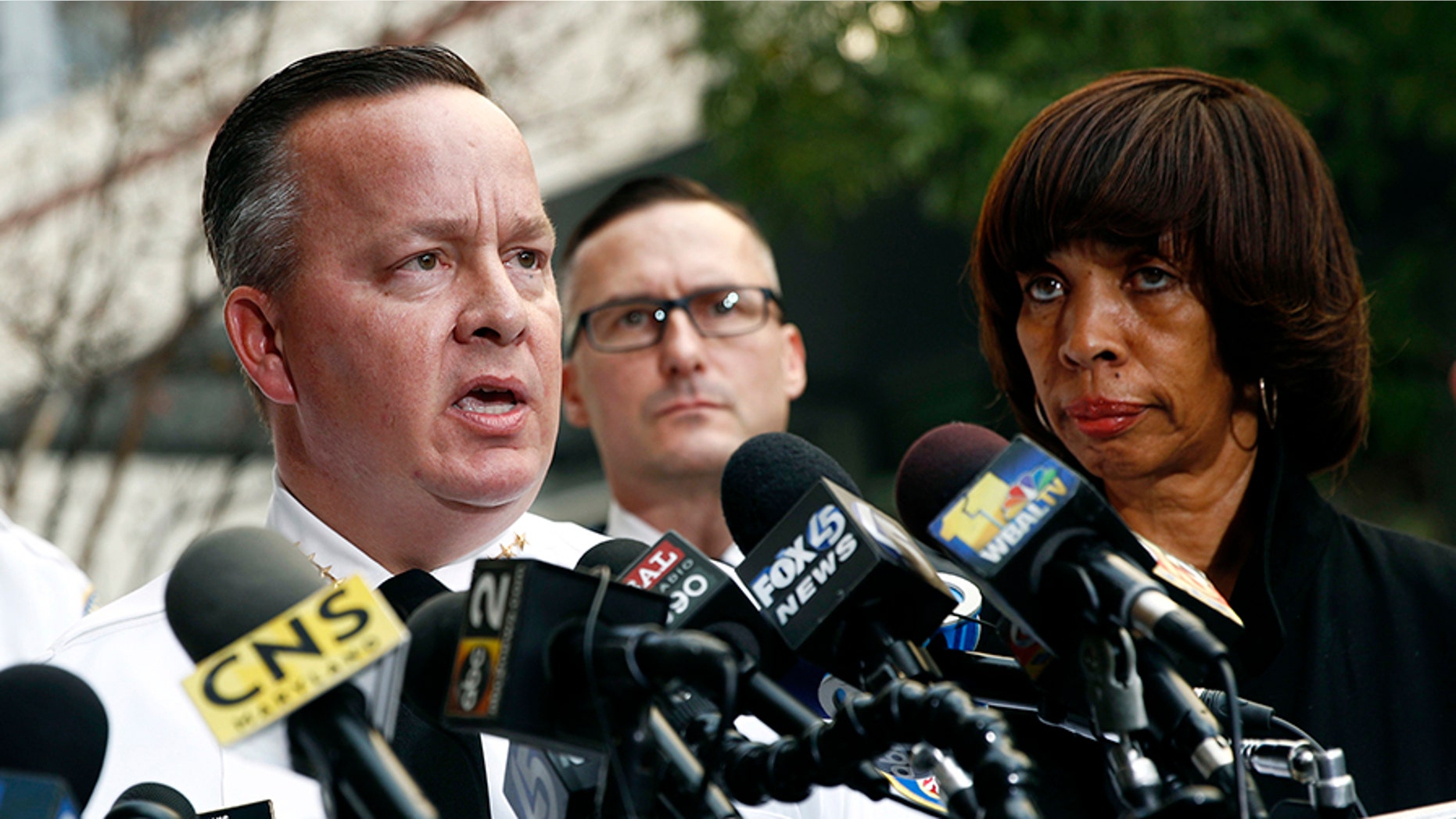 Baltimore Police Department Commissioner Kevin Davis, left, speaks alongside Mayor Catherine Pugh at a news conference last November.