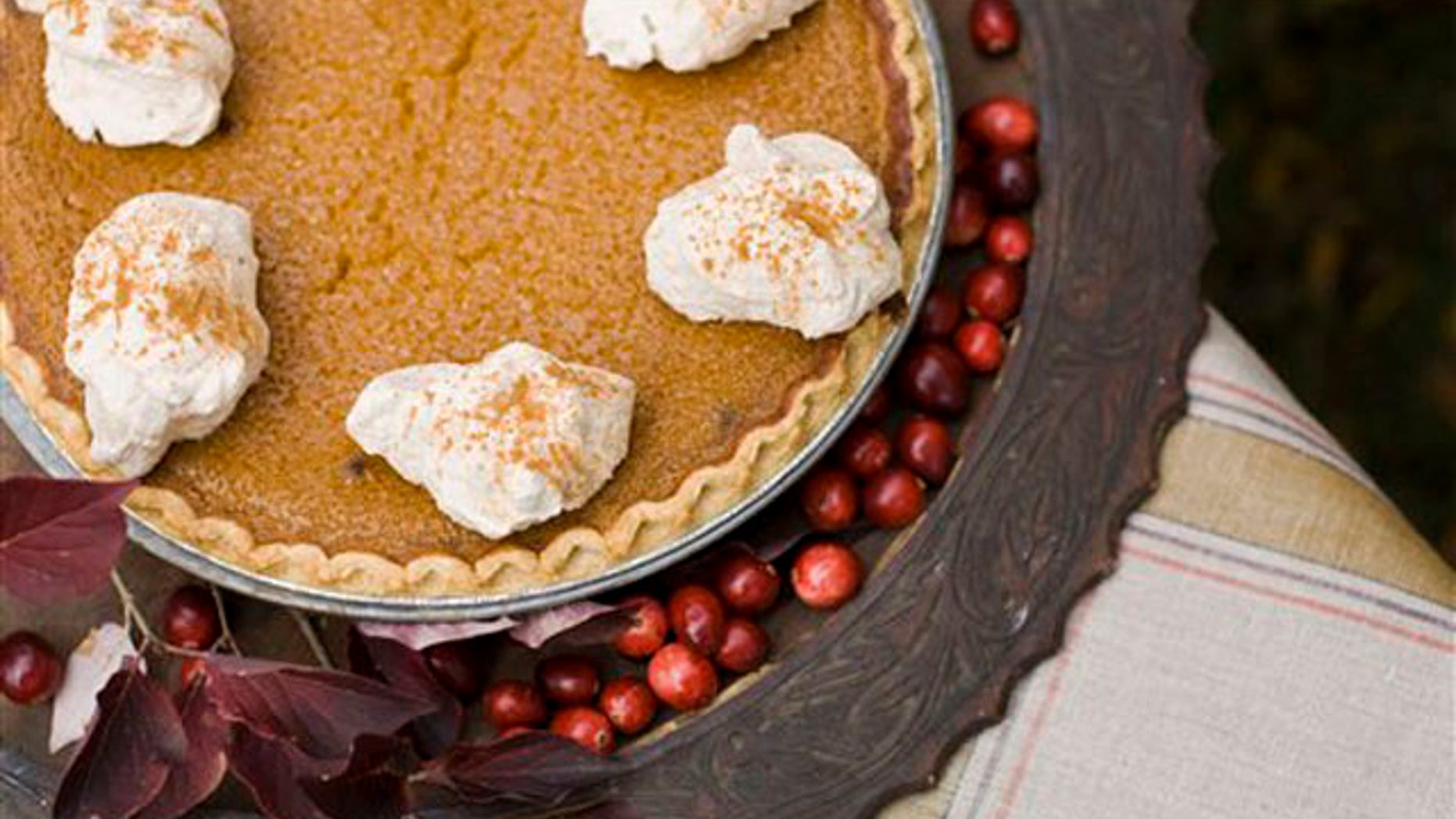 In this image taken on Oct. 8, 2012, a maple pumpkin pie with cinnamon-maple whipped cream is shown in Concord, N.H. (AP Photo/Matthew Mead)