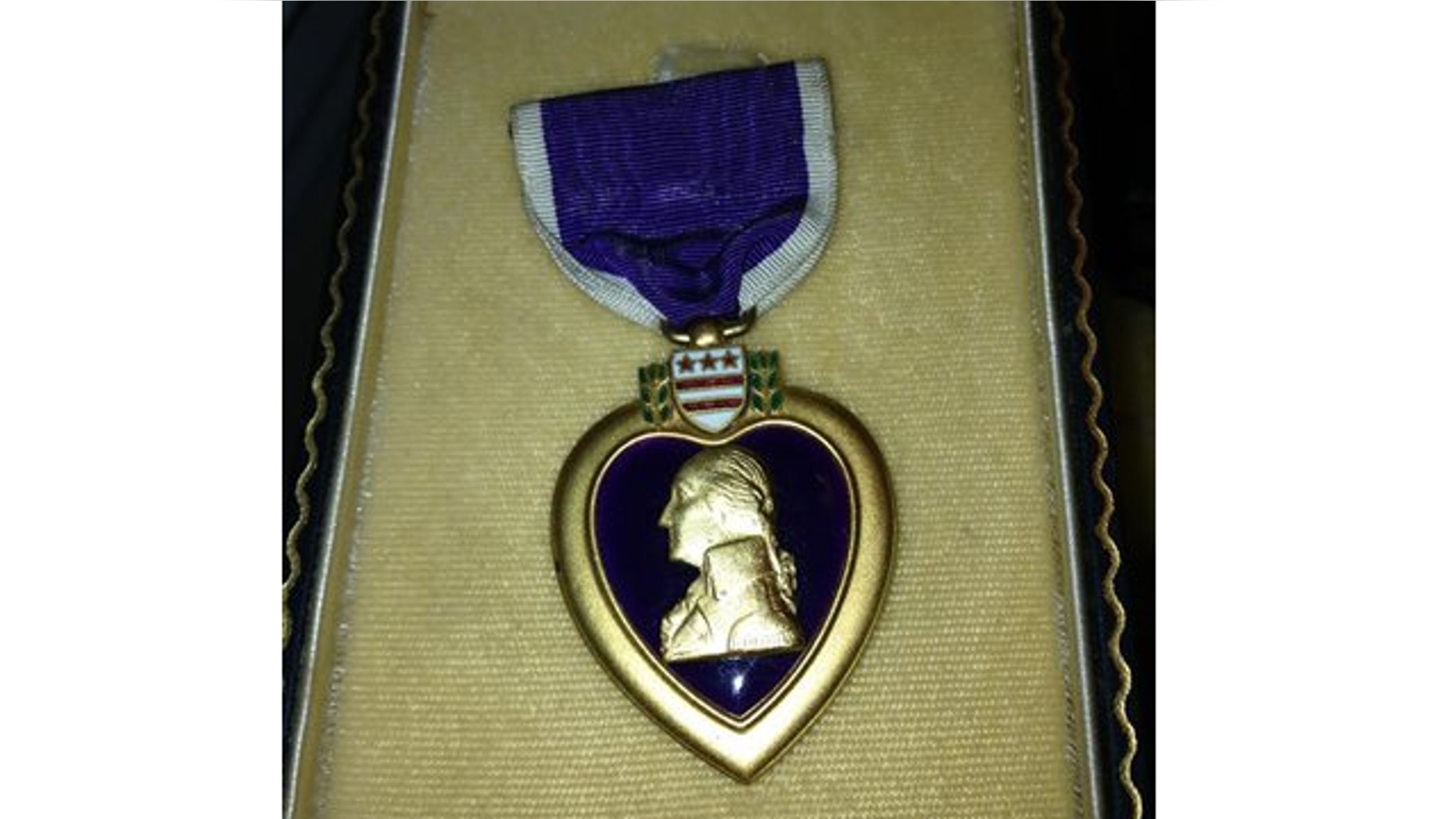 In this photo provided by Donna Gregory is the Purple Heart medal awarded to Pfc. John Farrell Eddington who was killed in action in Italy during World War II.