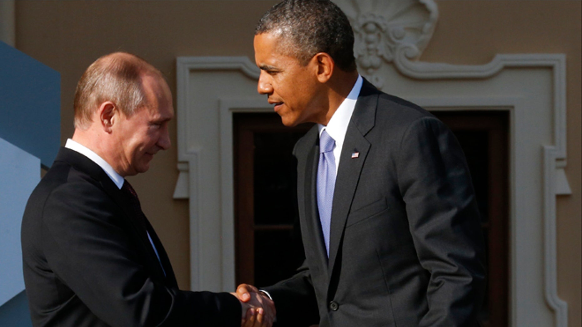Sept. 5, 2013: Russia's President Vladimir Putin, left, welcomes President Obama before the first working session of the G20 Summit in Constantine Palace in Strelna near St. Petersburg, Russia.