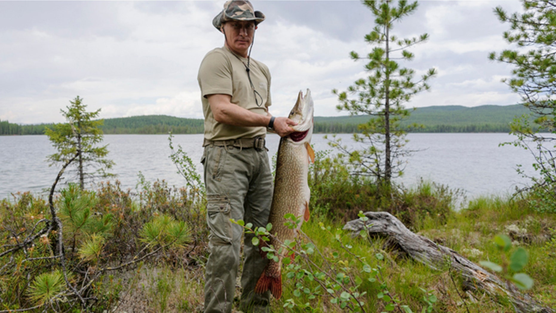 FILE 2013: President Vladimir Putin poses for a picture as he fishes in the Krasnoyarsk territory in the Siberian Federal District.