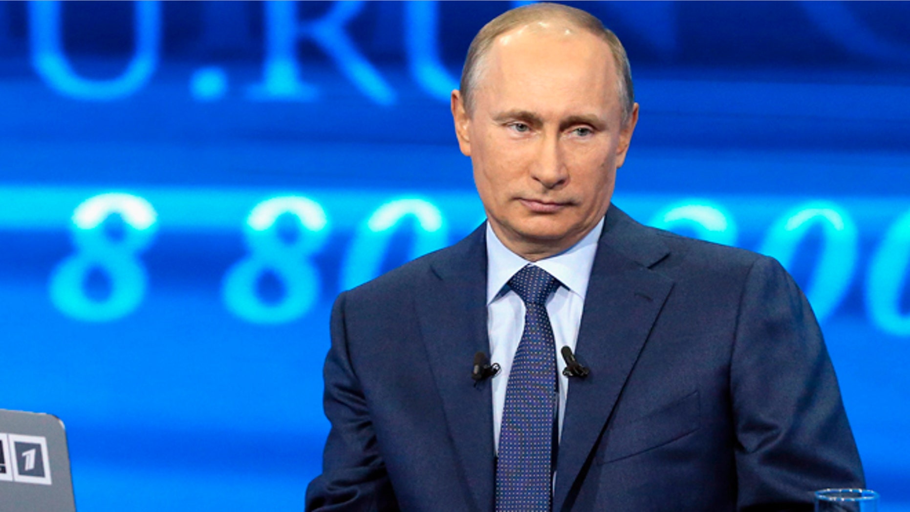 April 25, 2013: Russian President Vladimir Putin listens to a question during an annual call-in show on Russian television "Conversation With Vladimir Putin" in Moscow.