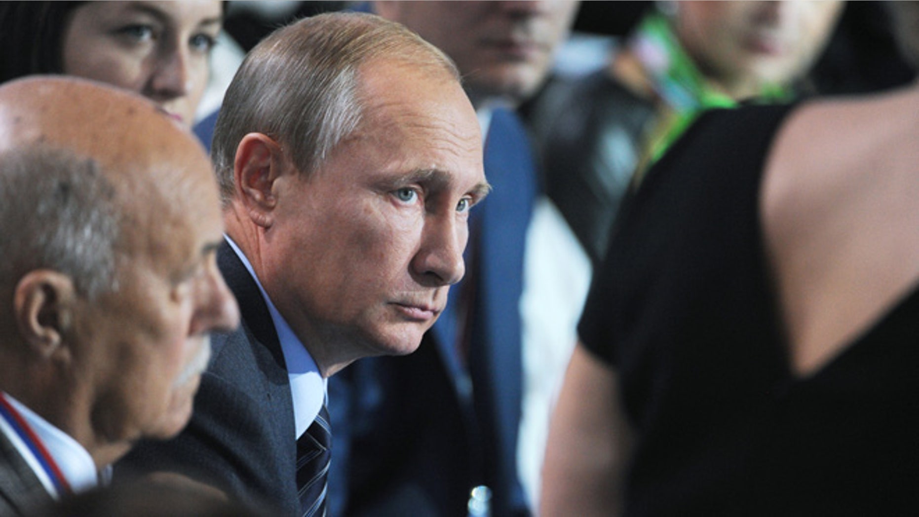 Sept. 7, 2015: Russian President Vladimir Putin, center, listens to a question during a meeting with his supporters in Moscow, Russia.