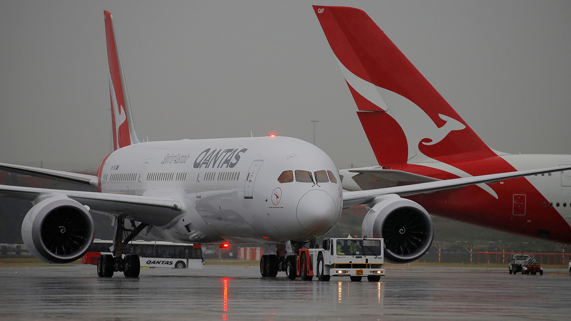 Qantas Airline's airport lounge refused entry to singer Joanne Catherall because of her shoes.