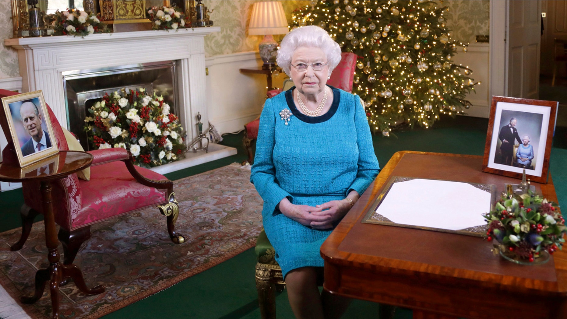 Dec. 25, 2016: Britain's Queen Elizabeth II poses for a photo while sitting at a desk in the Regency Room of Buckingham Palace in London, after recording her traditional Christmas Day broadcast to the Commonwealth.